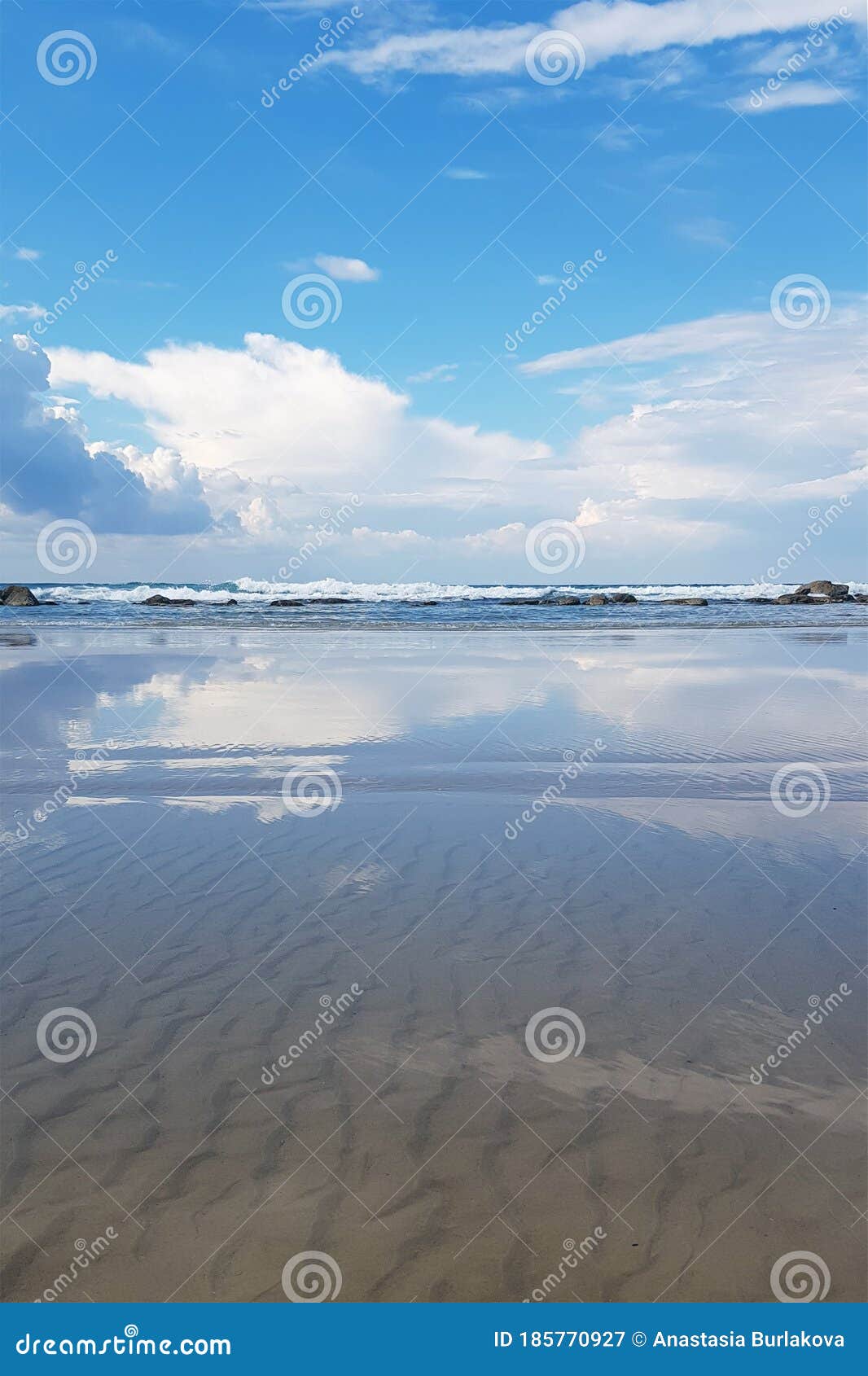 blue sky and clouds are reflected in the water. sea shore. the concept of calm and conciliation.