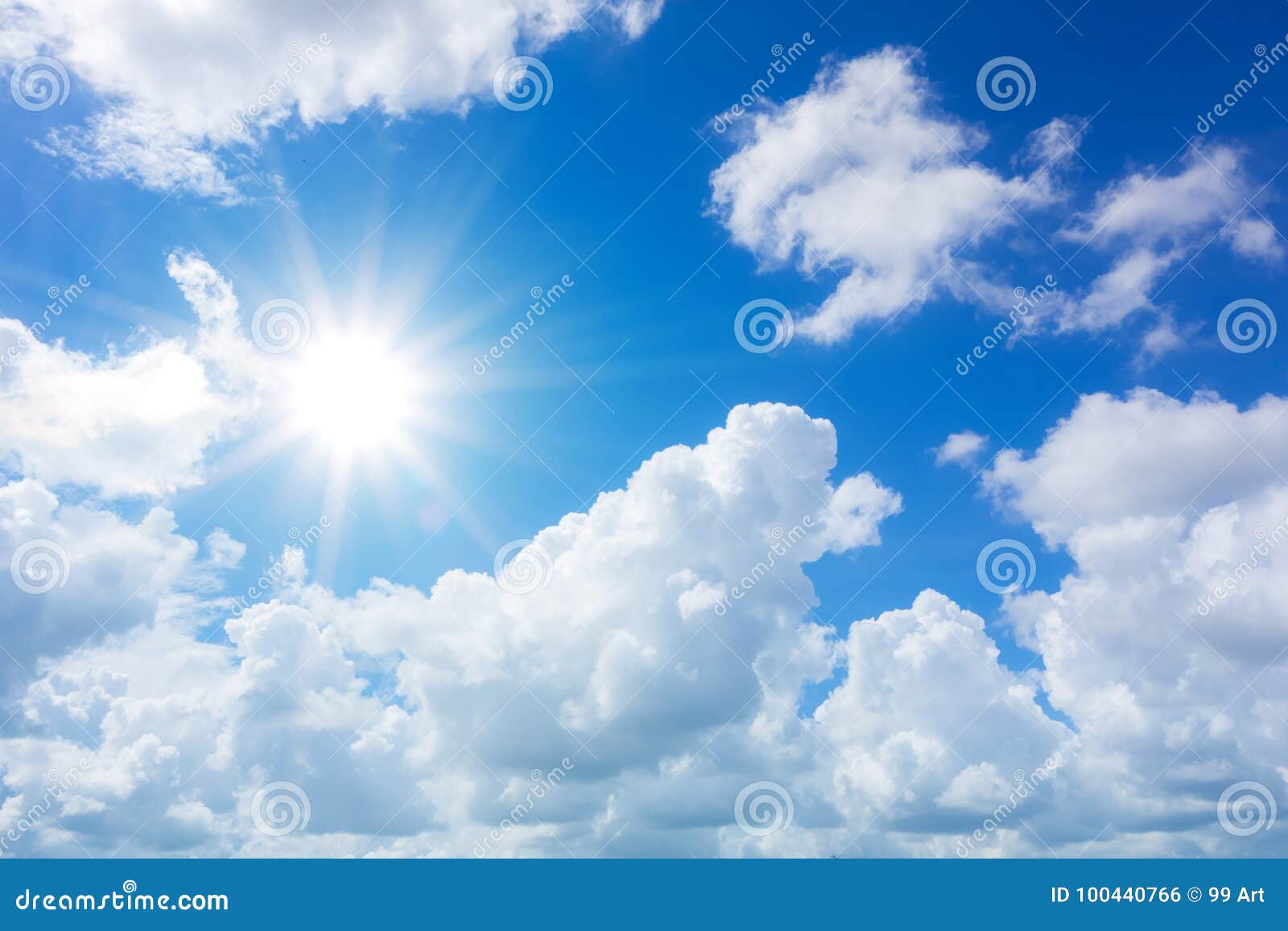 blue sky with clouds and sun reflection.the sun shines bright in