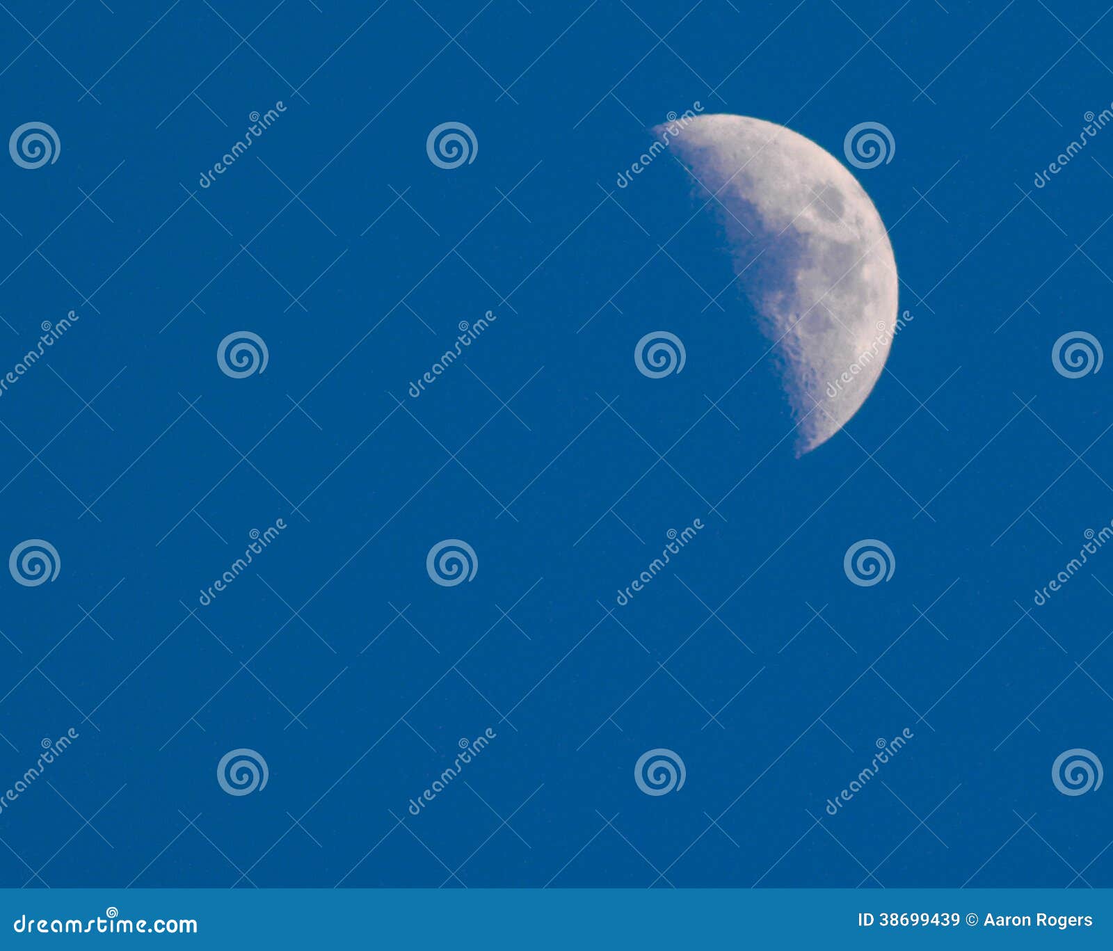 blue sky daytime half moon