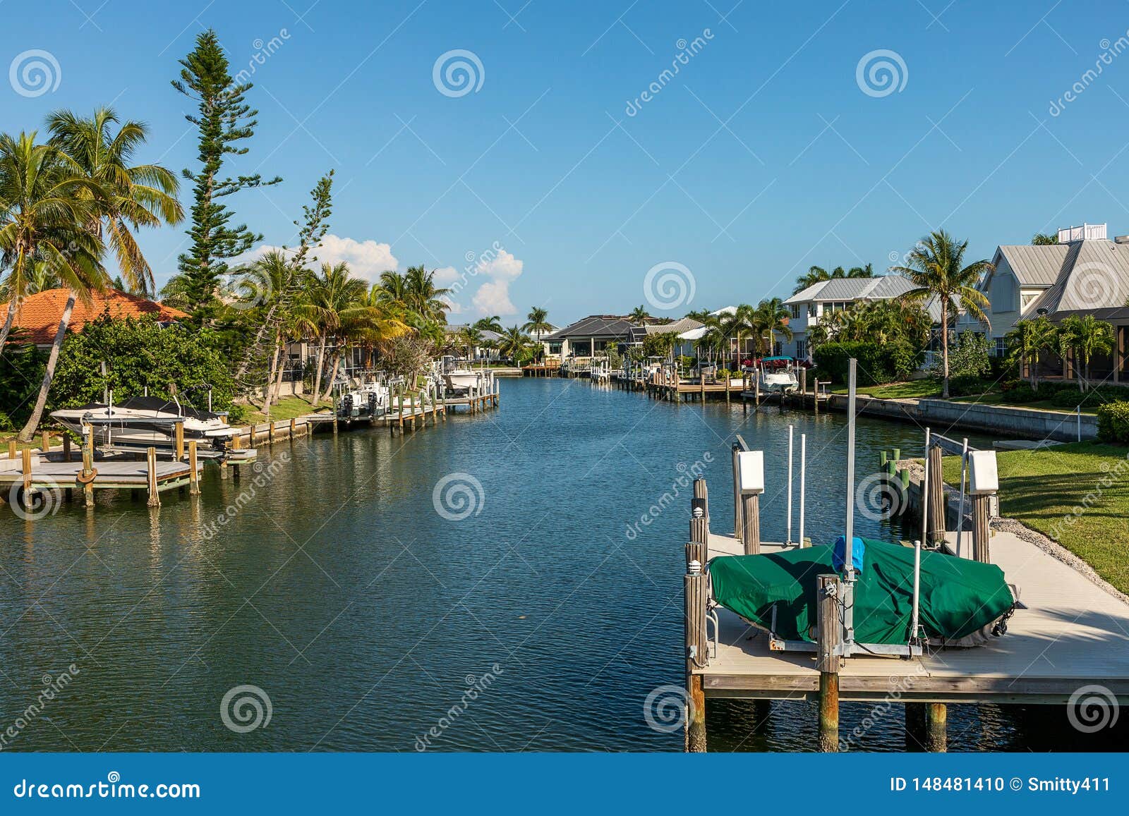 blue sky over a riverway through marco island in naples