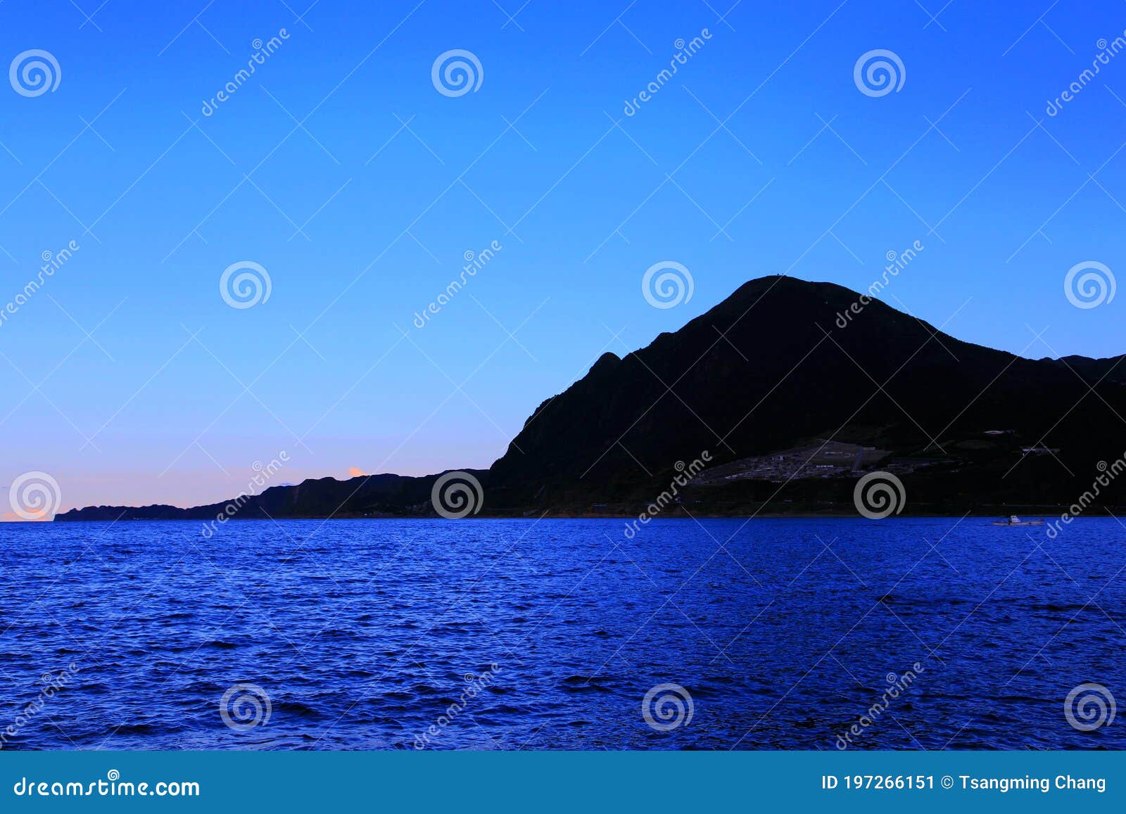 blue sky with peacefull cotton clouds and sunset scenery of taiwan`s north coast