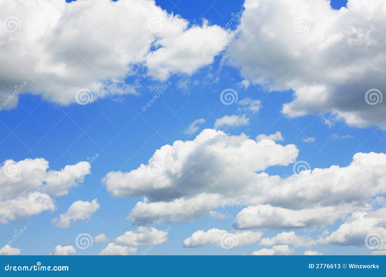 blue sky and puffy clouds
