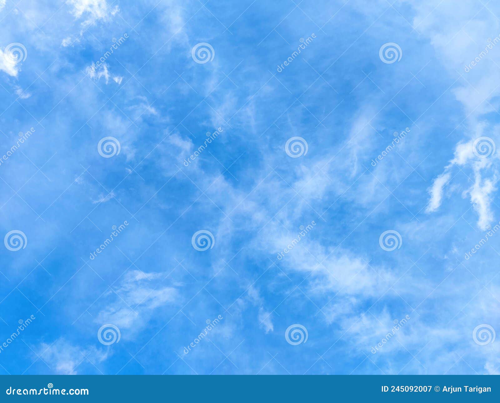 blue sky soft clouds