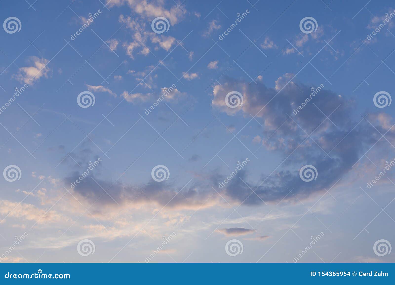 Blue Sky With White Clouds In Arch Form With Red Coloring By
