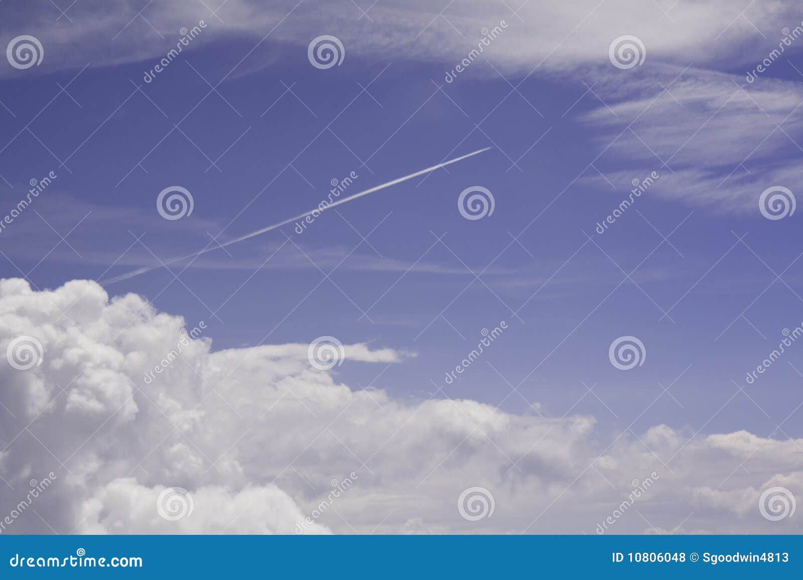 Blue Sky, White Clouds and Jet Condensation Trail Stock Photo Image