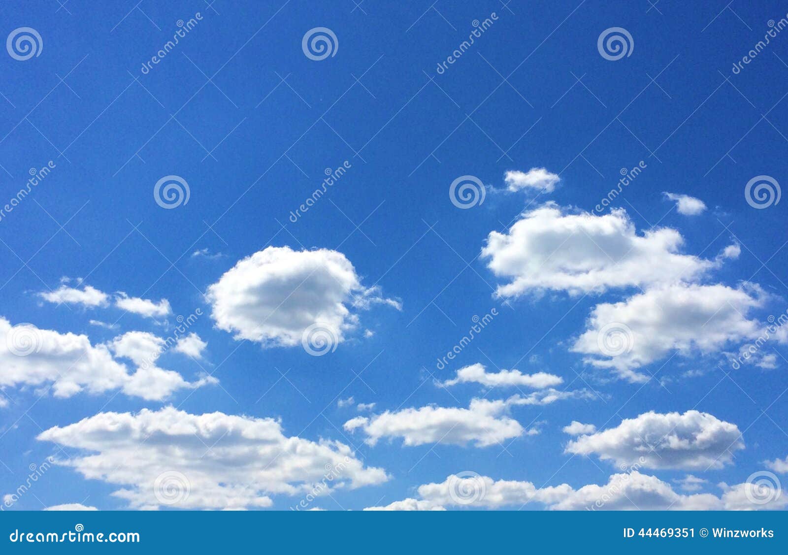 blue sky and white puffy clouds