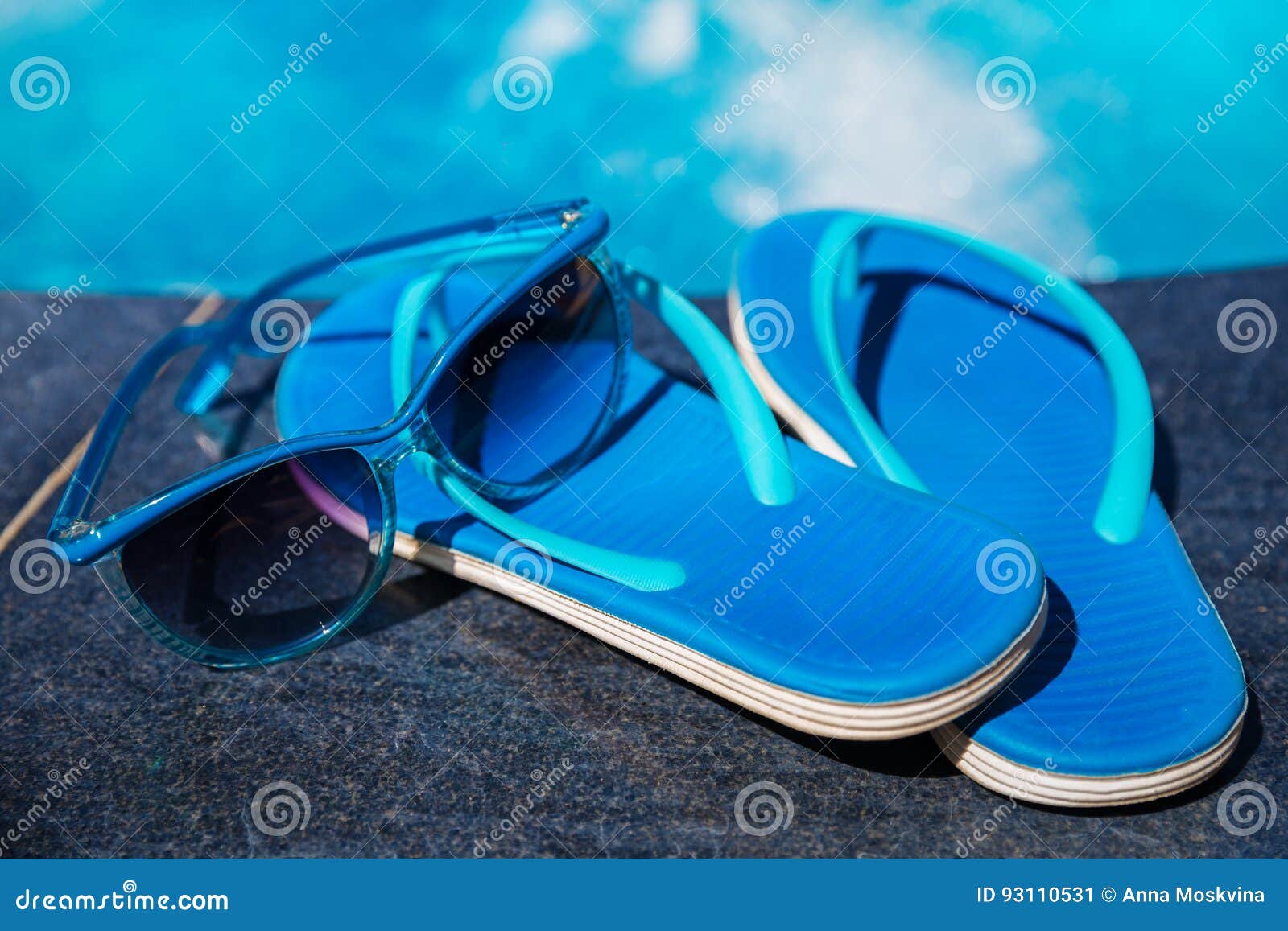 Blue Slippers and Sun Glasses Near Swimming Pool Stock Image - Image of ...