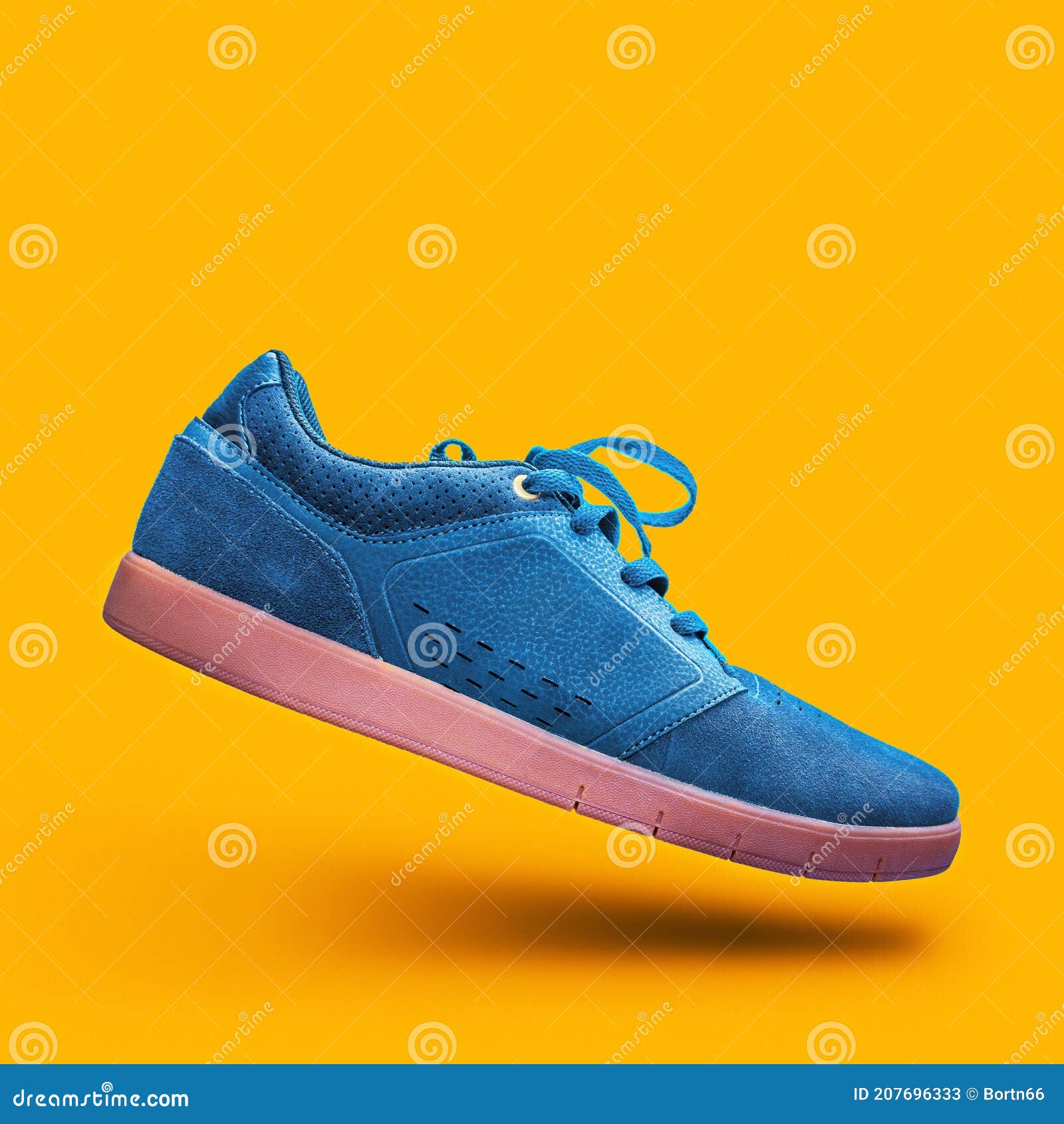 Blue Sneakers on a Yellow Background Stock Image - Image of background ...