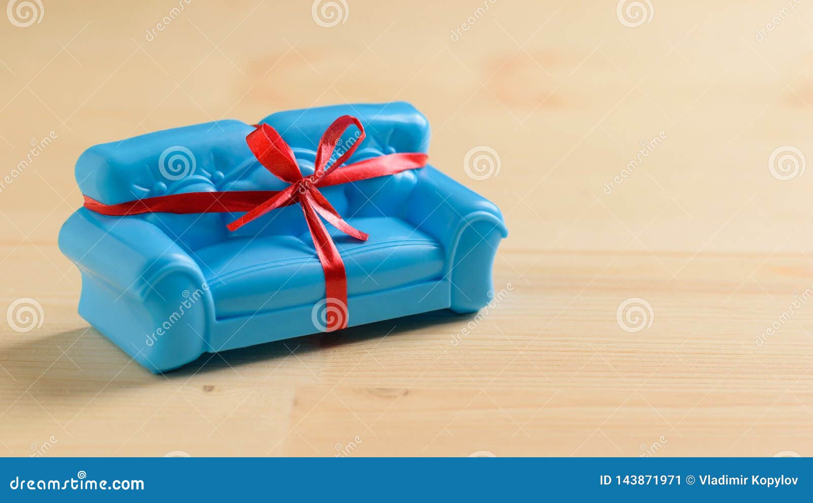 Blue Sofa With Red Ribbon Wooden Floor Made Of Light Wood Unusual