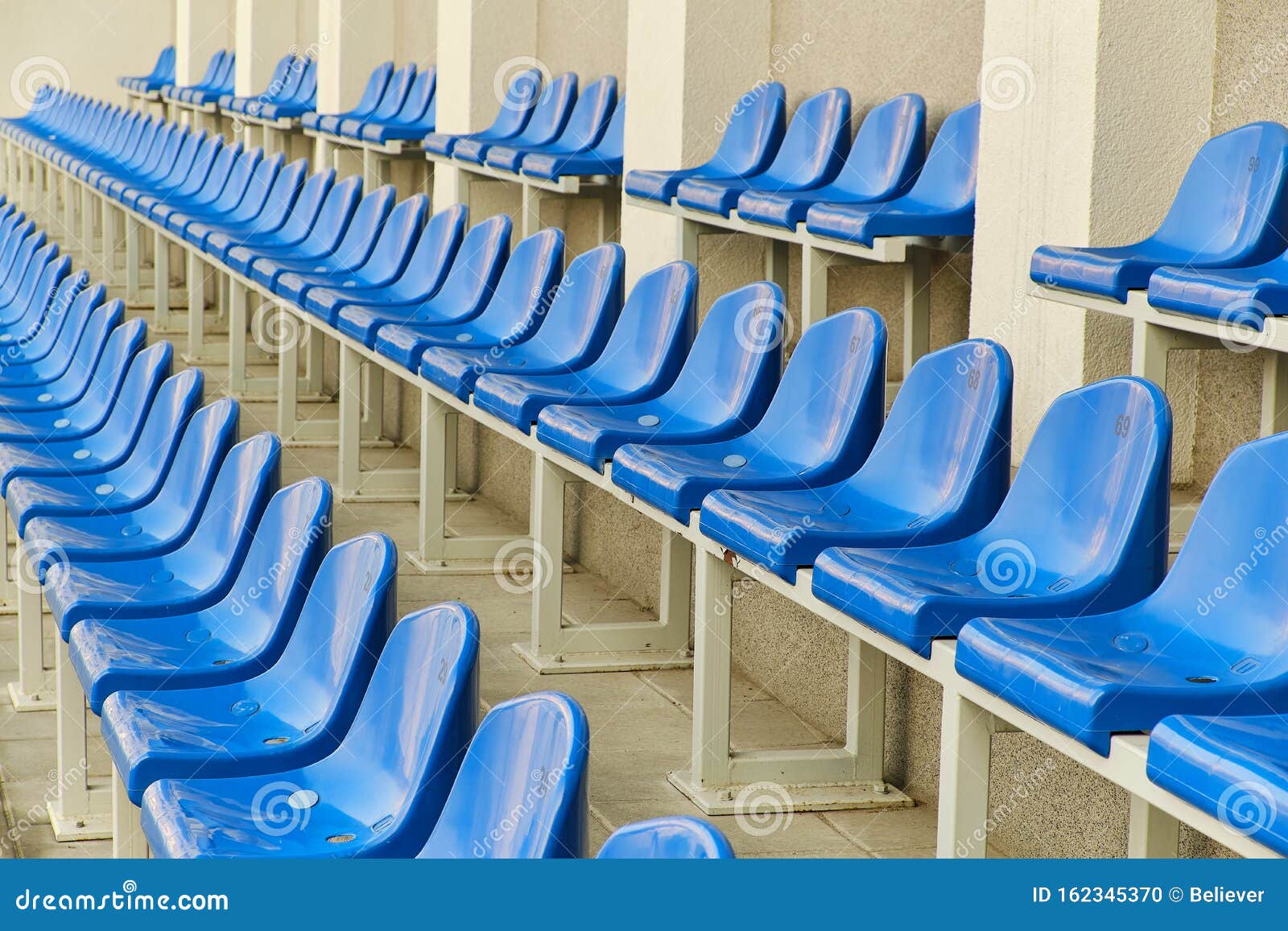 Blue stadium seats stock photo. Image of arena, line 162345370
