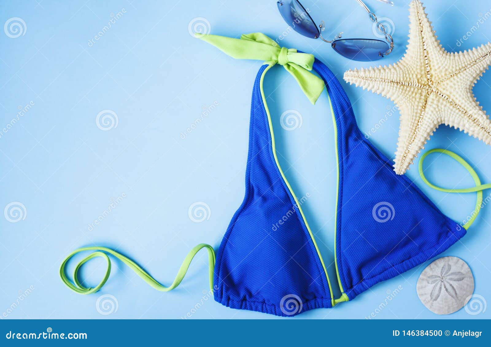 Blue Swimsuit, Sunglasses and Starfish on Blue Background. Beach ...