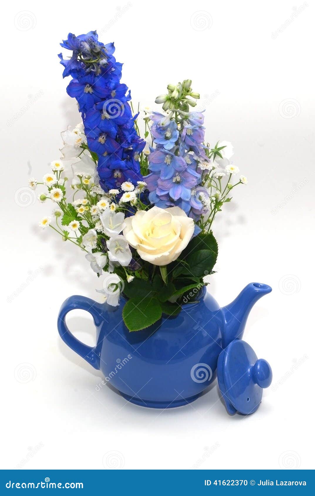 Blue teapot with bouquet stock photo. Image of kettle 41622370