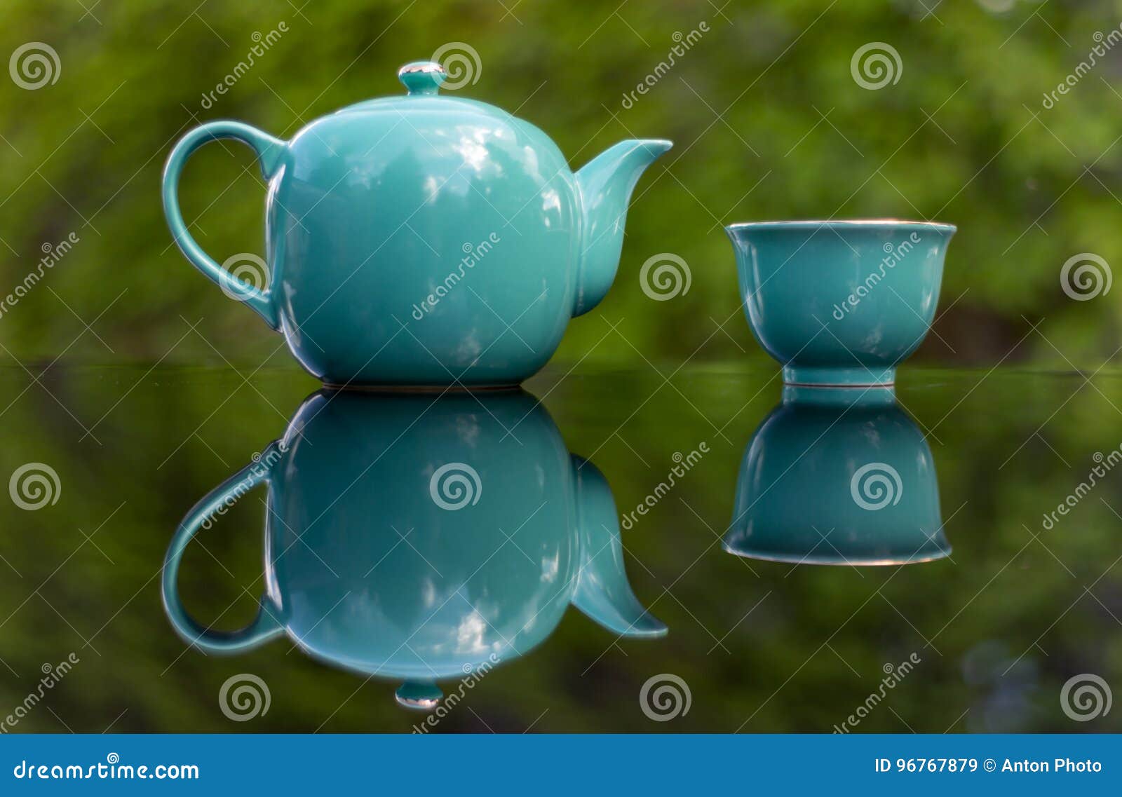 Blue Teapot with Cups on Green Background Stock Image Image of drink