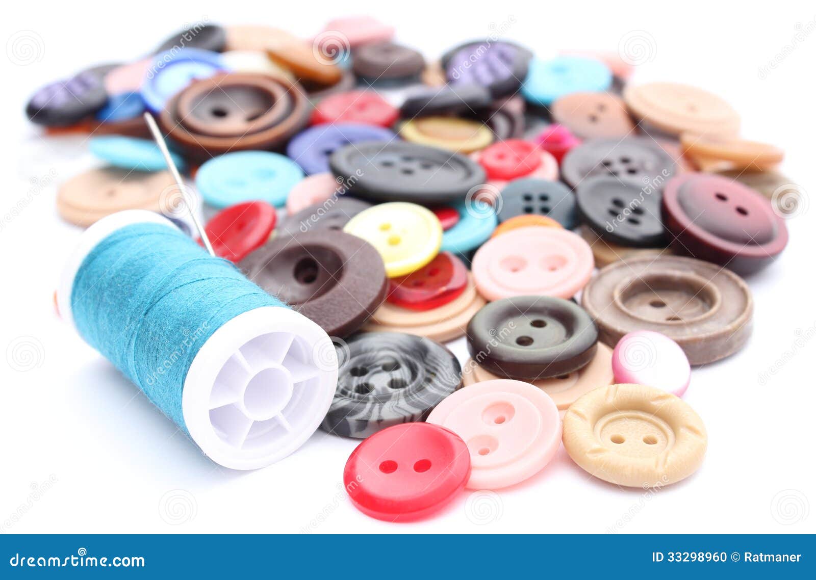 Blue Thread with Needle and Collection of Colored Sewing Buttons Stock