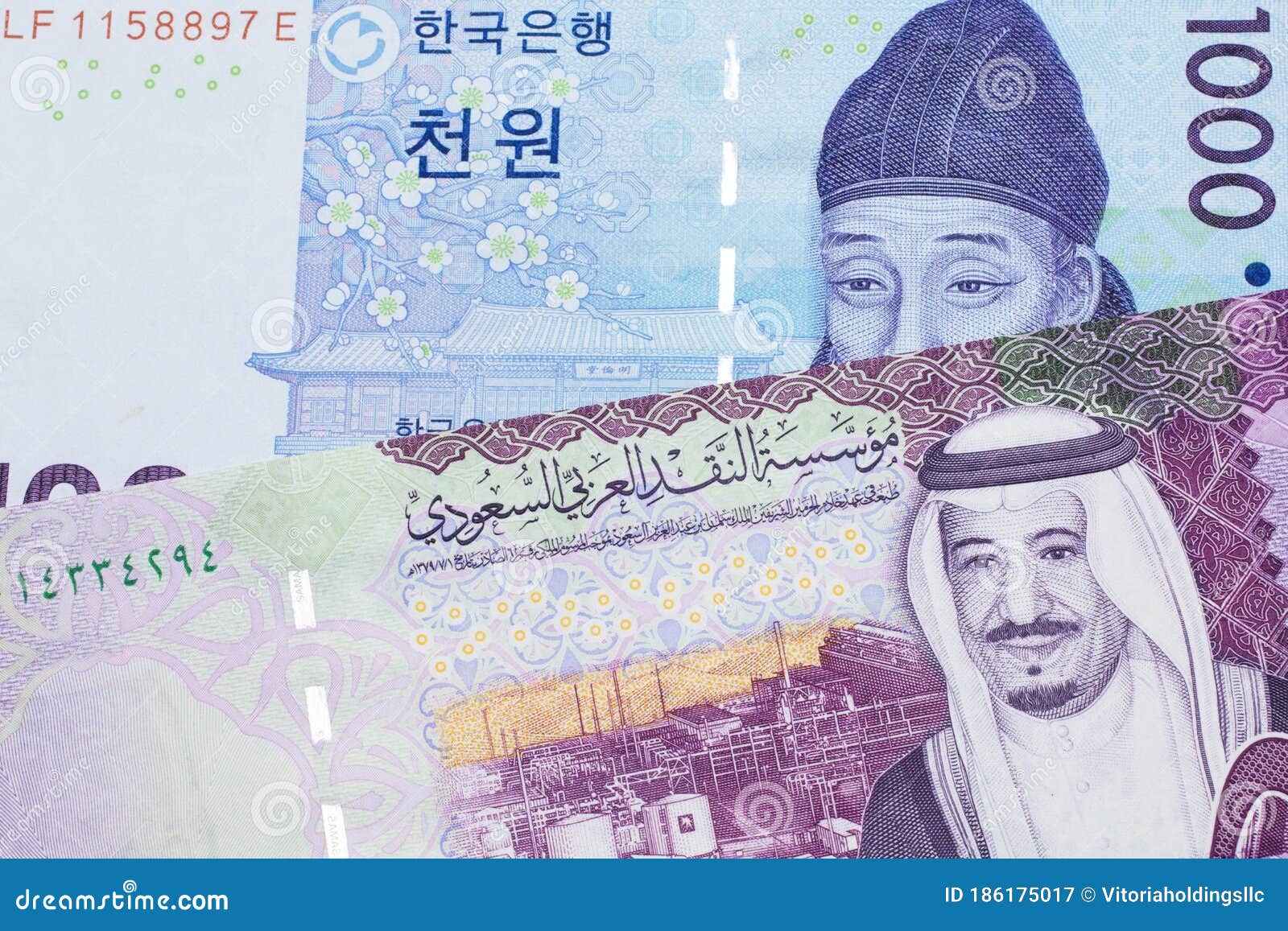 a blue won note from south korea with a five riyal note from saudi arabia