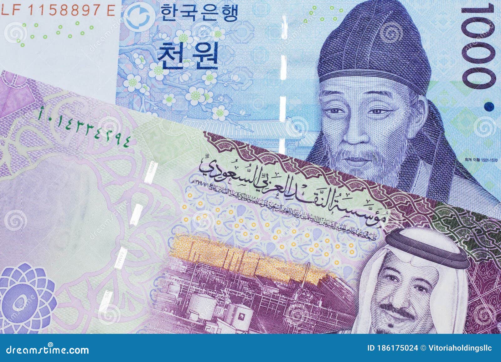 a blue won note from south korea with a five riyal note from saudi arabia