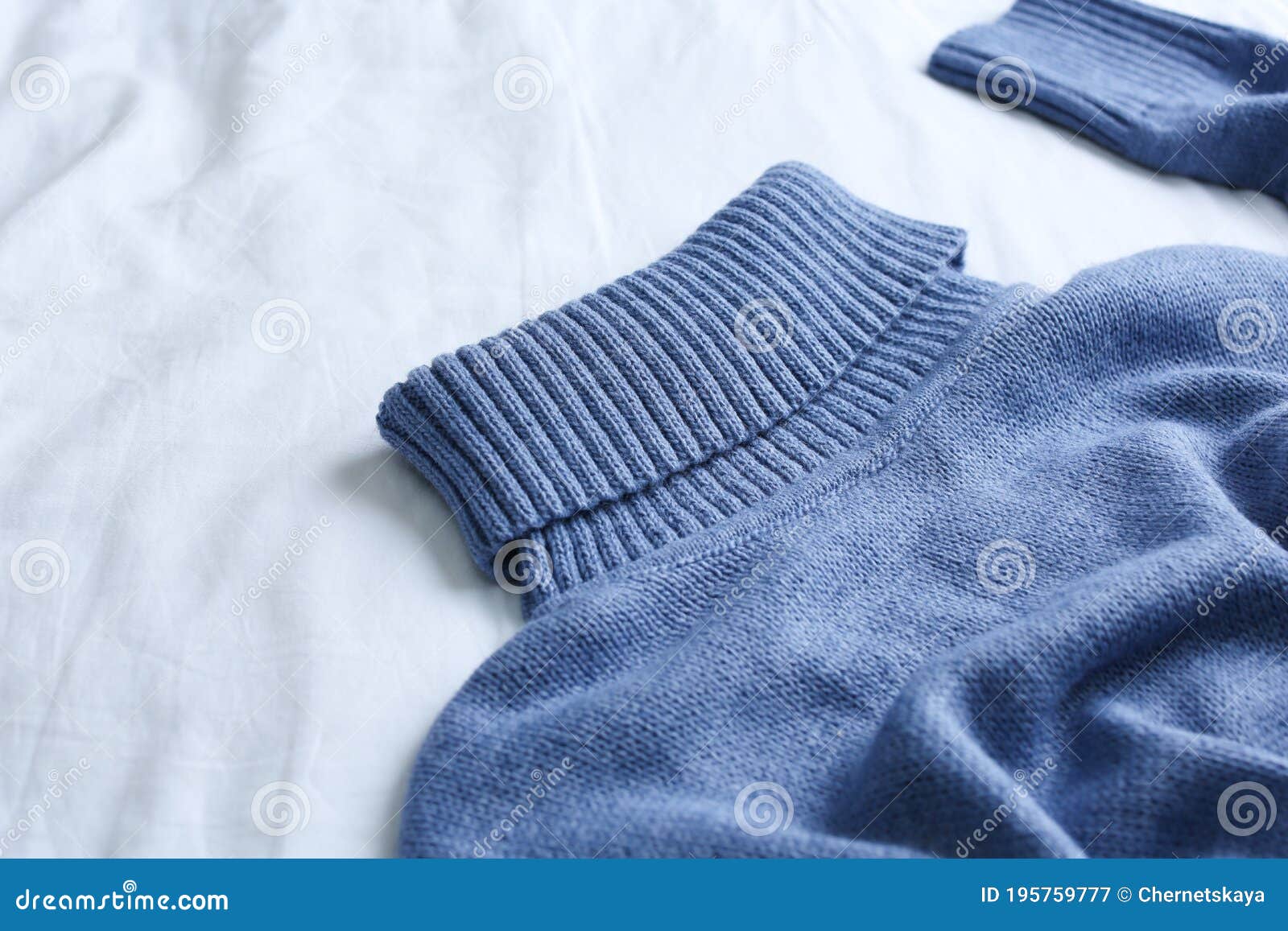 Blue Warm Sweater on White Crumpled Fabric, Closeup Stock Image - Image ...