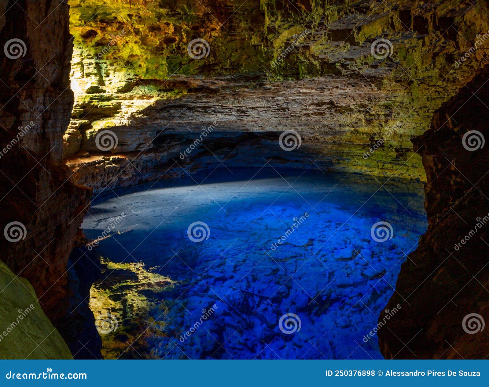 the blue water of poÃÂ§o encantado or enchanted well, in a cave of chapada diamantina national park, bahia, brazil.