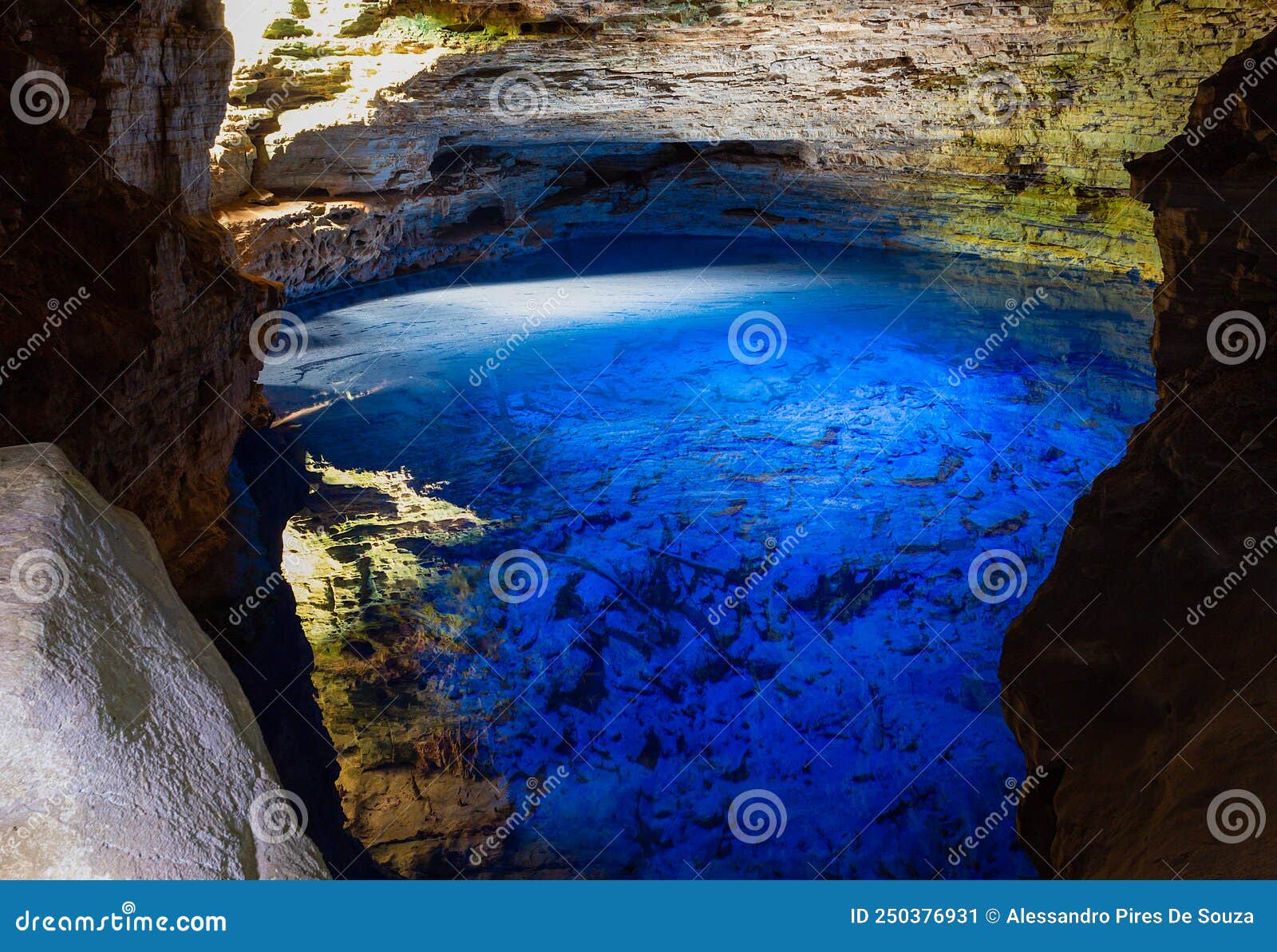 the blue water of poÃÂ§o encantado or enchanted well, in a cave of chapada diamantina national park, bahia, brazil.