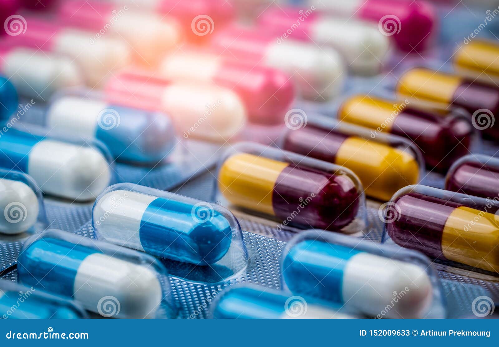 blue-white capsule pills in blister pack. pharmaceutical industry. drug package. pharmaceutics concept. drug use in hospital.