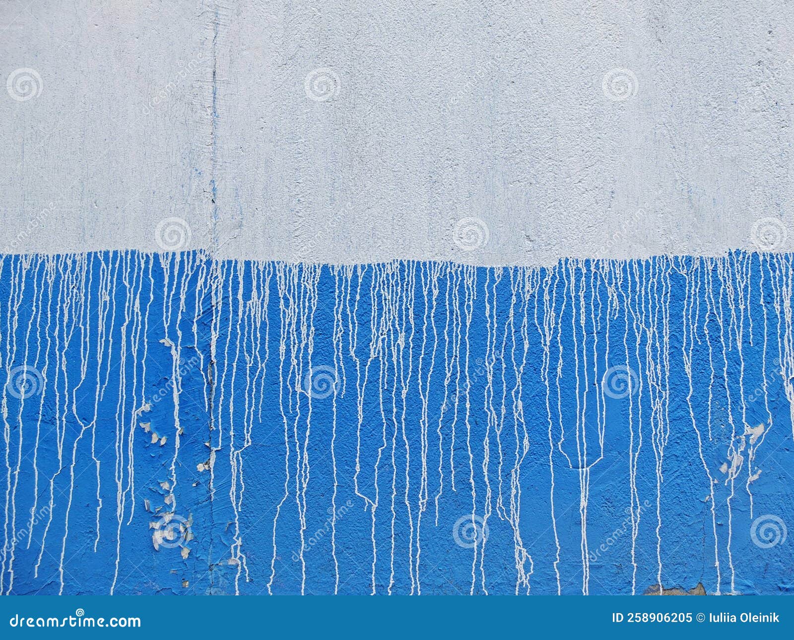Blue and White Concrete Wall with White Streaks of Paint Stock Image