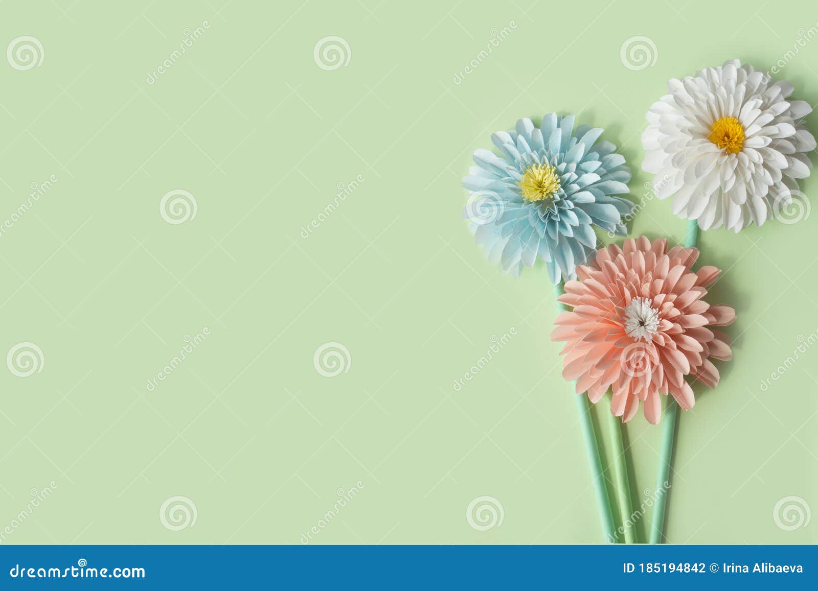 Blue, White and Pink Paper Flowers on Stems on a Green Background ...