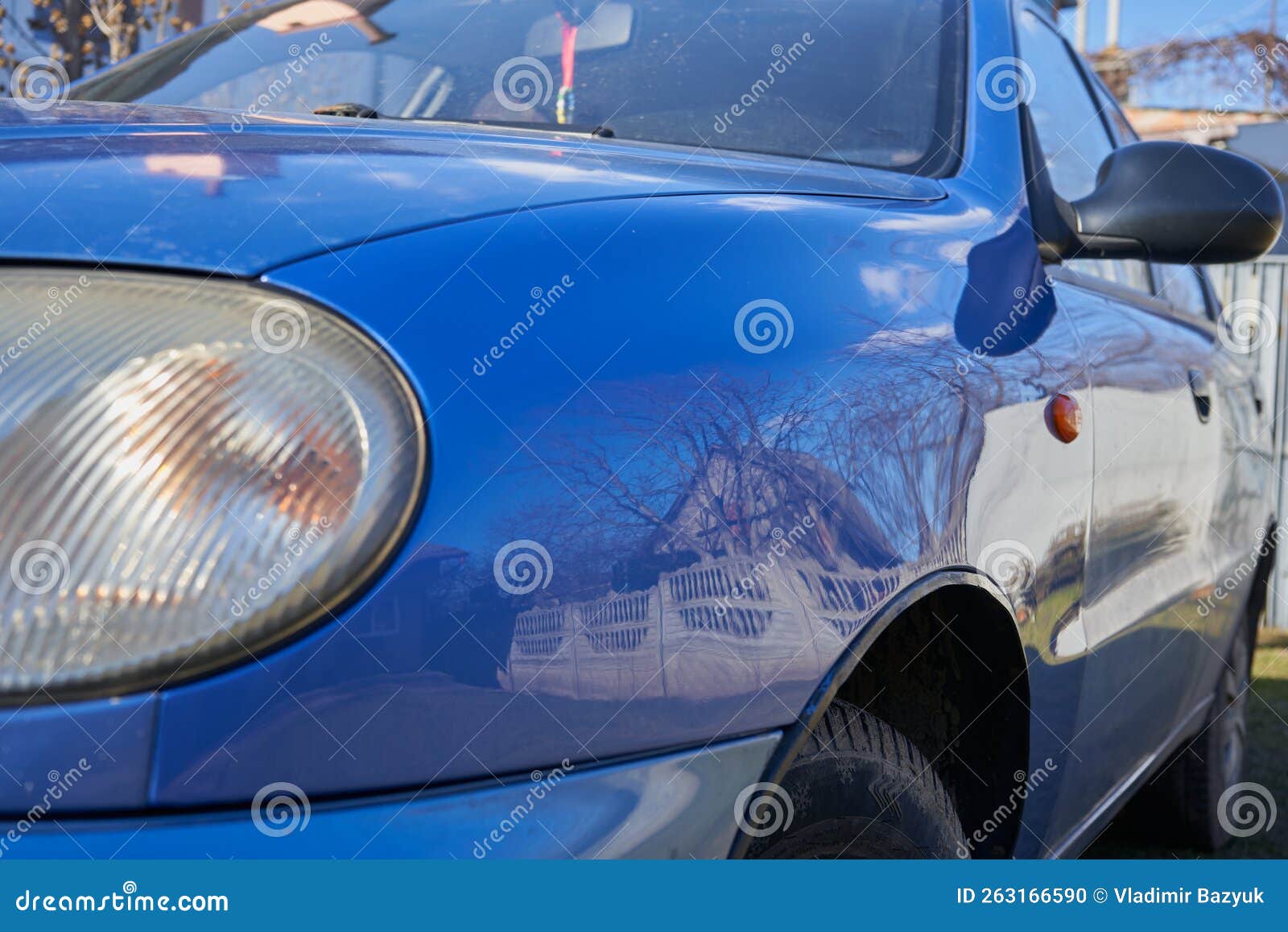 Blue Wing of the Car is Polished,painted Front Fenders of a Car