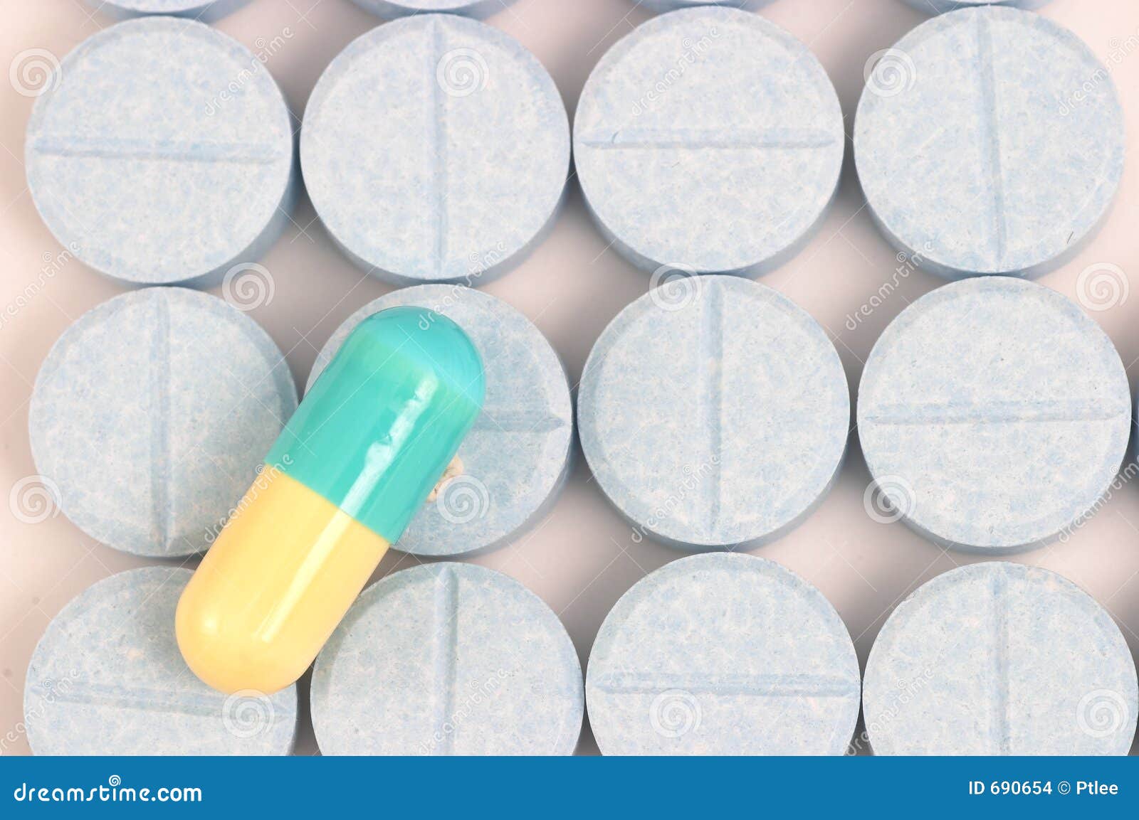 Blue Yellow Capsule On Blue Pills Lined Up Stock Images Image 690654