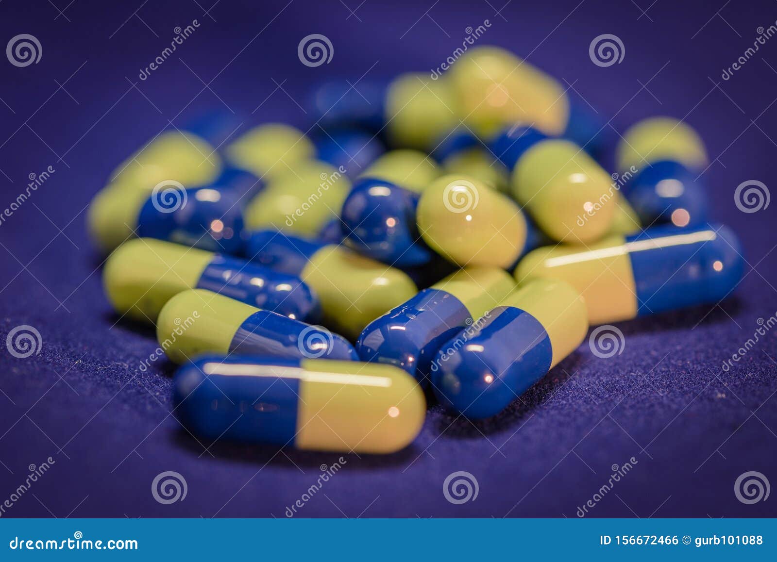 Blue and yellow capsules stock photo. Image of antibiotic 156672466