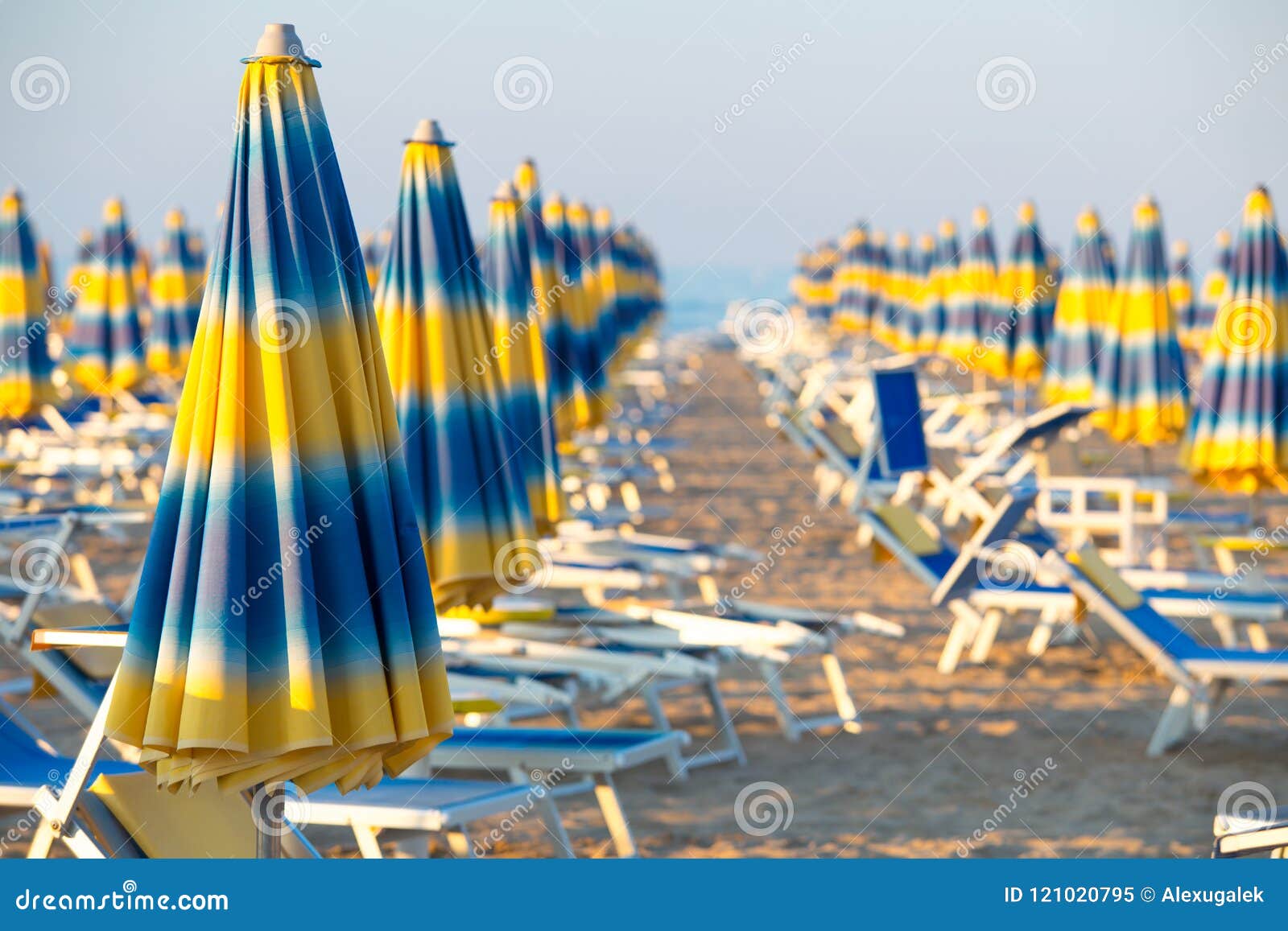 Blue and Yellow Umbrellas on Beach Stock Image - Image of sunny, beach ...