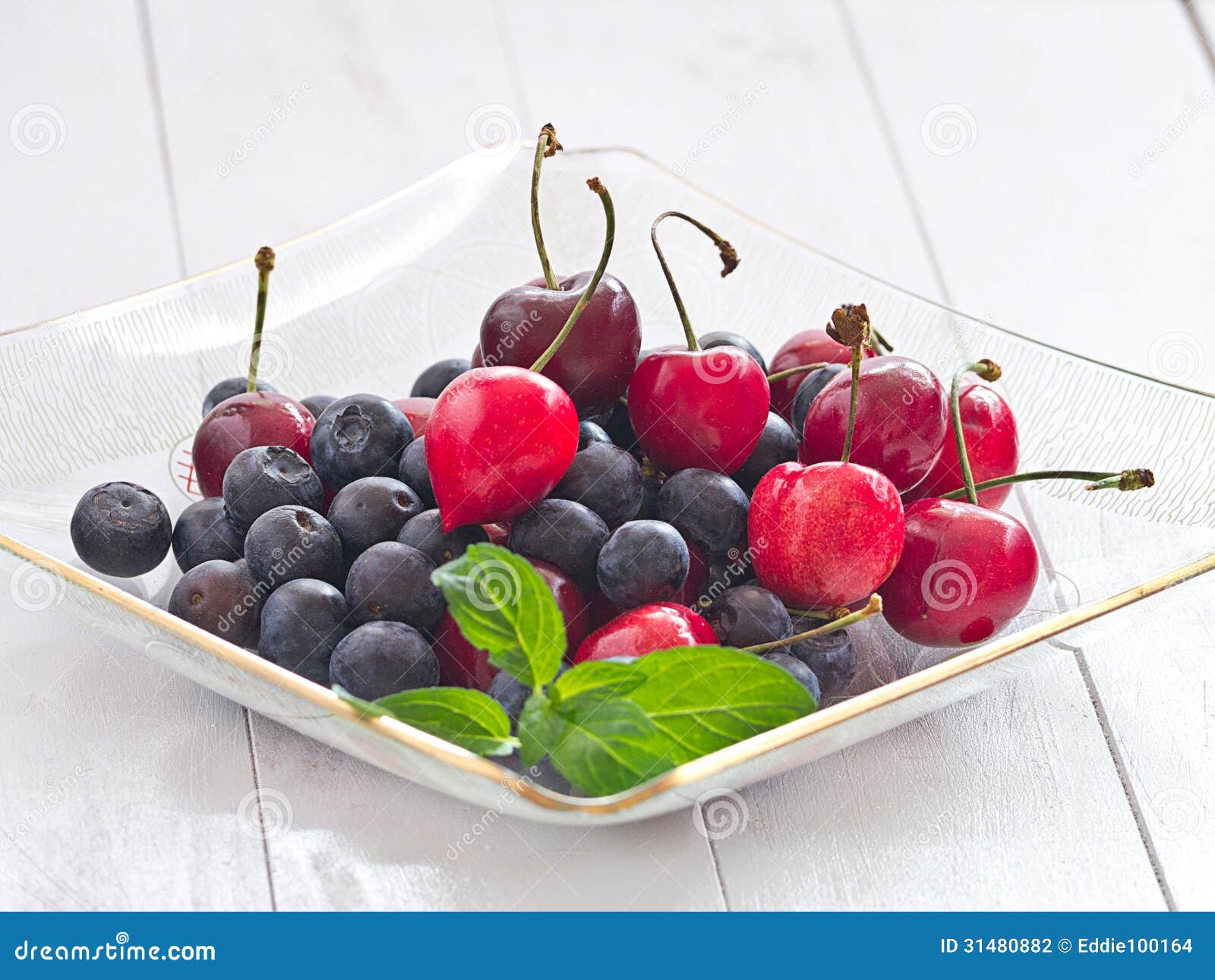 Blueberries and cherries stock photo. Image of glass 31480882