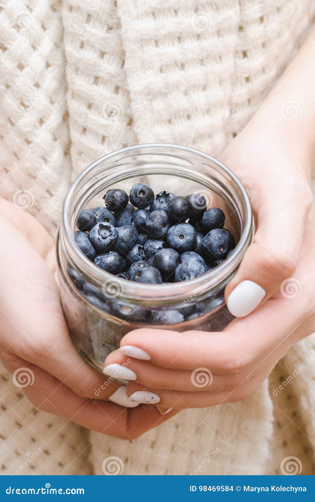 Blueberry in Glass Jar in Female Hands. Stock Photo Image of