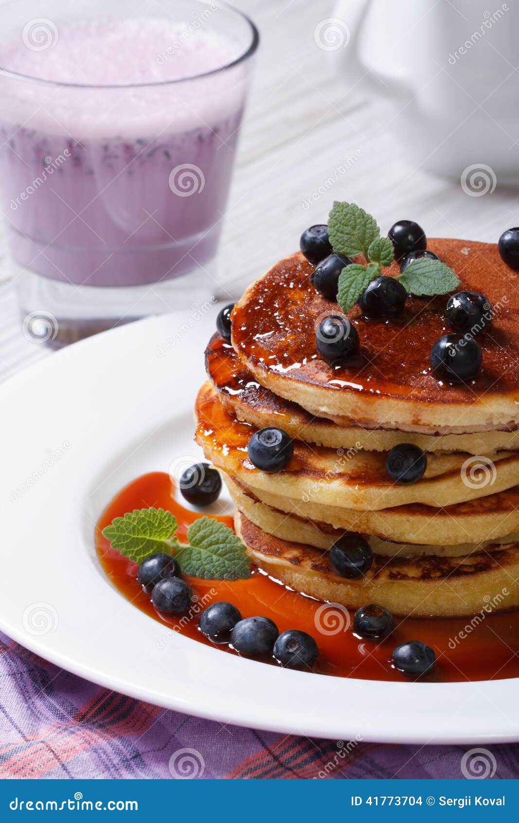 Blueberry Pancakes with Maple Syrup and a Cocktail Closeup Stock Photo