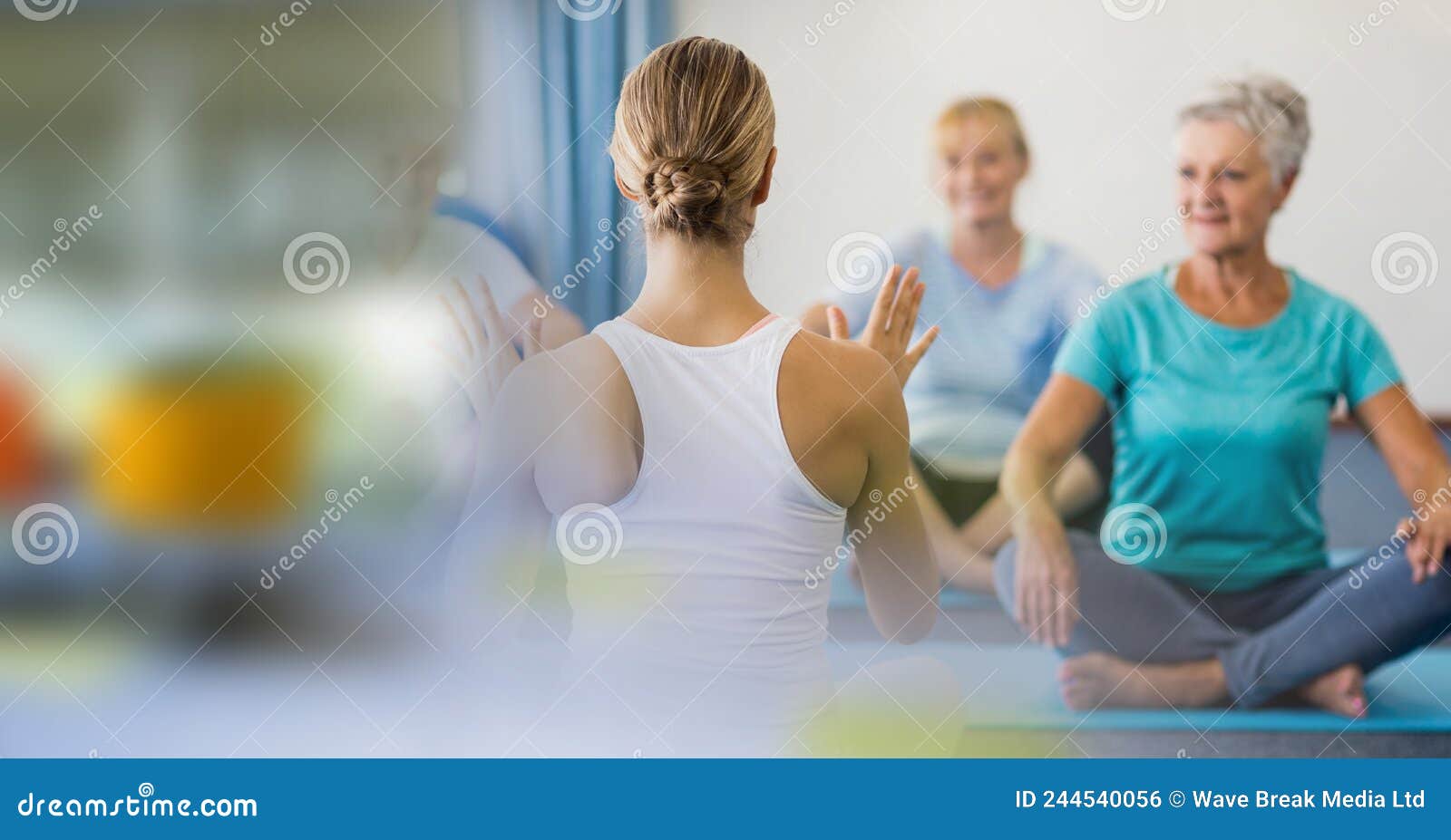 Blur Effect with Copy Space Against Female Yoga Trainer and Group of ...