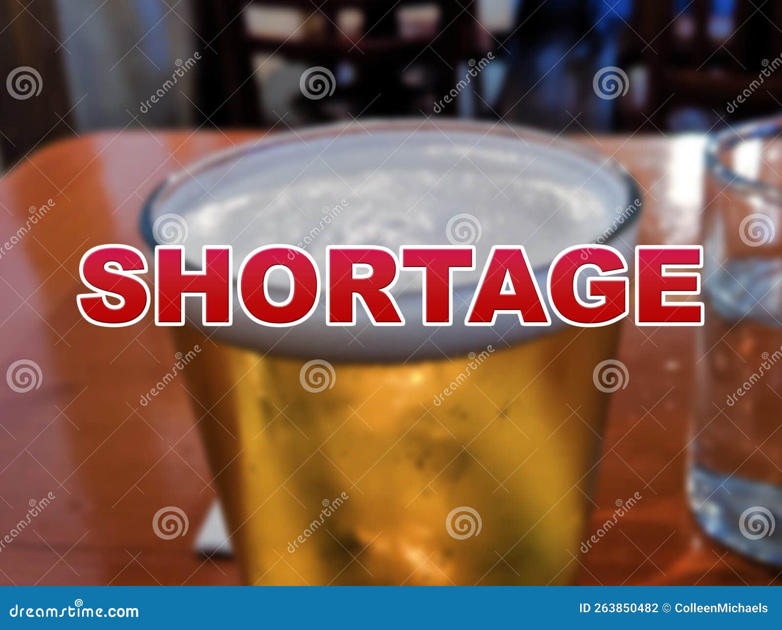 Blurred Background of a Glass of Beer with the Word Shortage in the