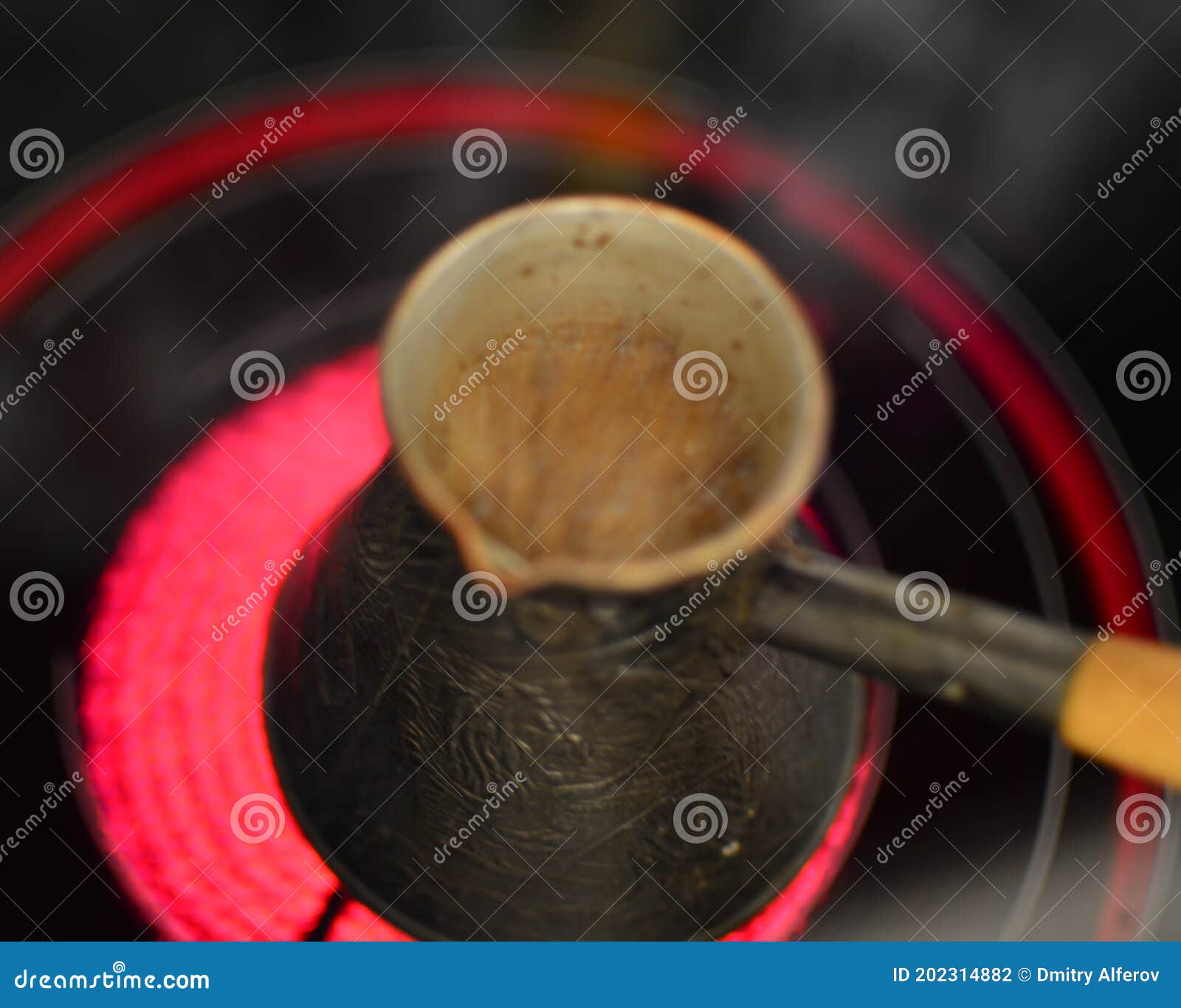 Blurred Boiling Turkish Coffee Pot on Electric Stove Stock Photo