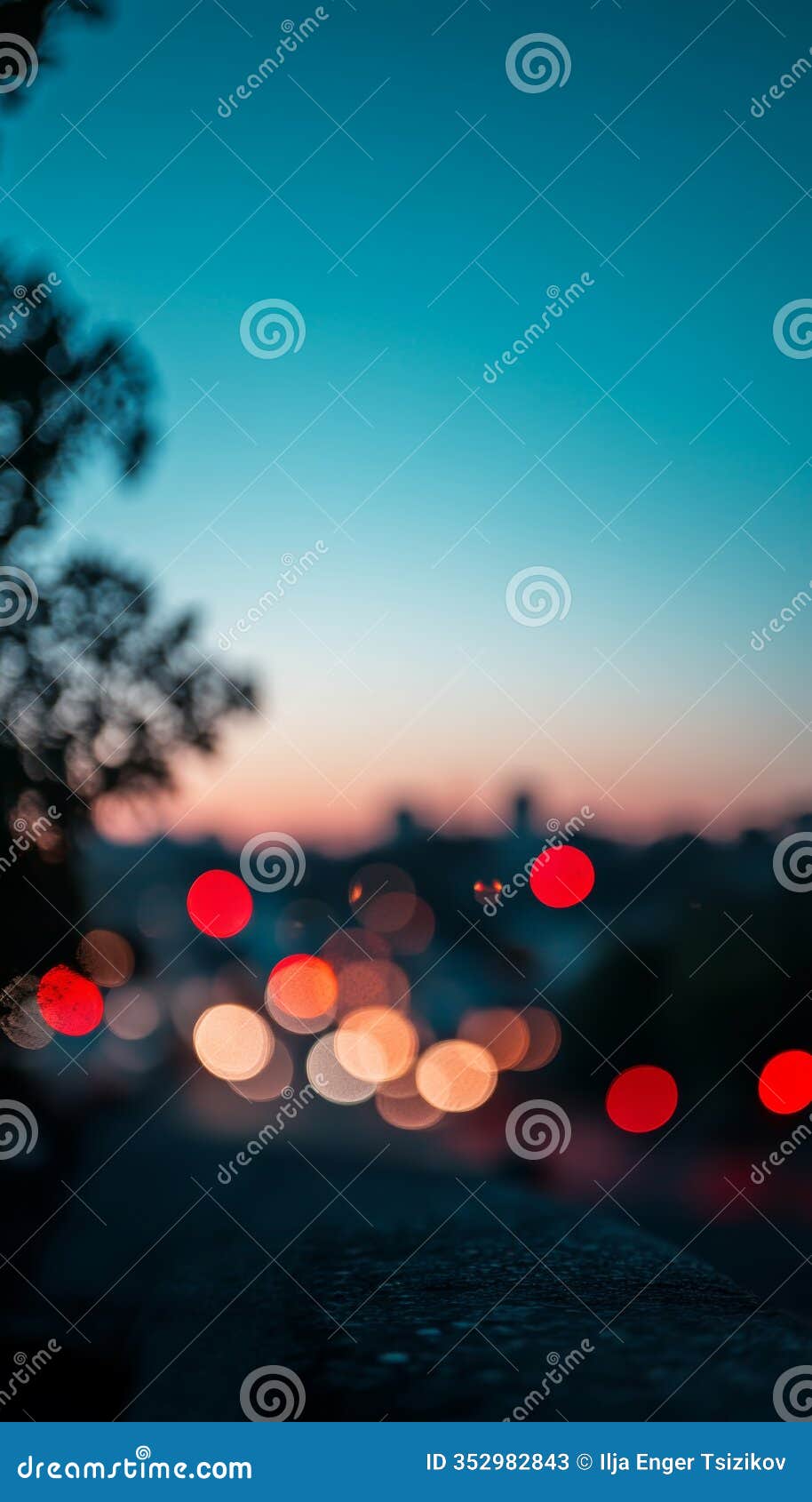 blurred city lights at dusk, urban landscape with colorful bokeh effect and twilight sky