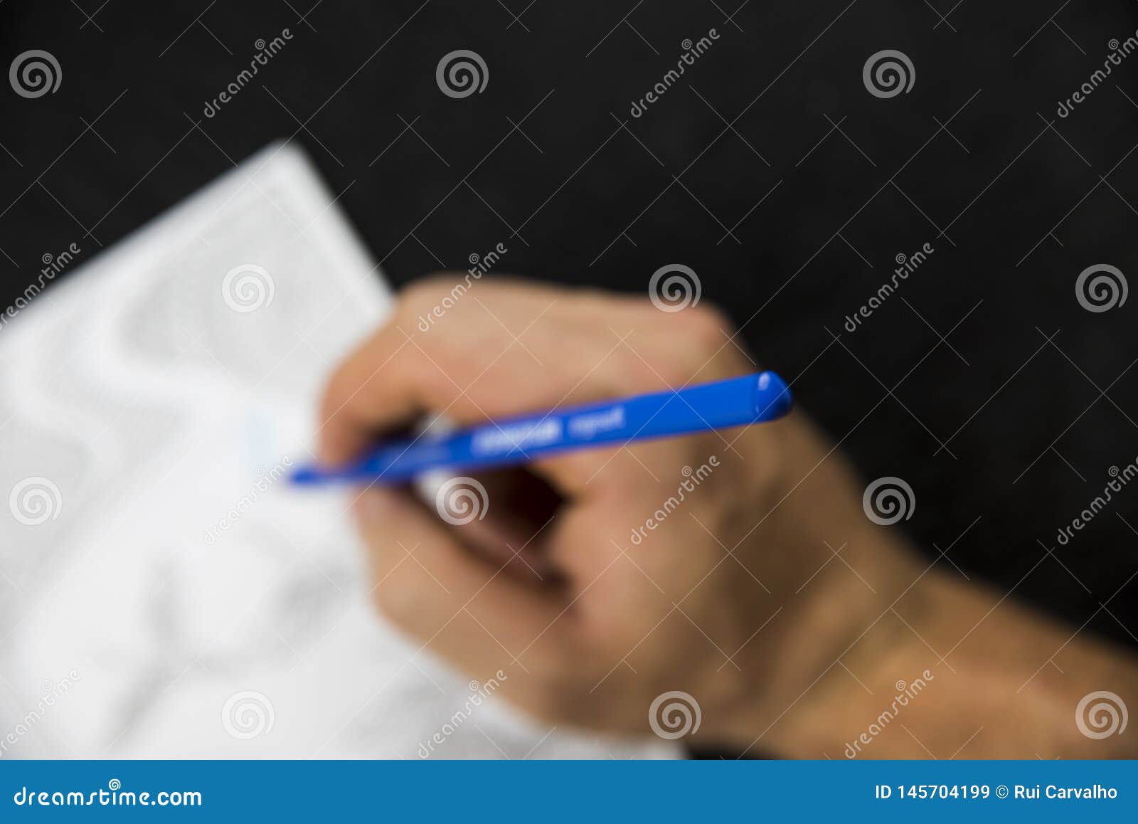 Blurred Hand Handling a Blue Pencil Colouring Stock Image - Image of ...