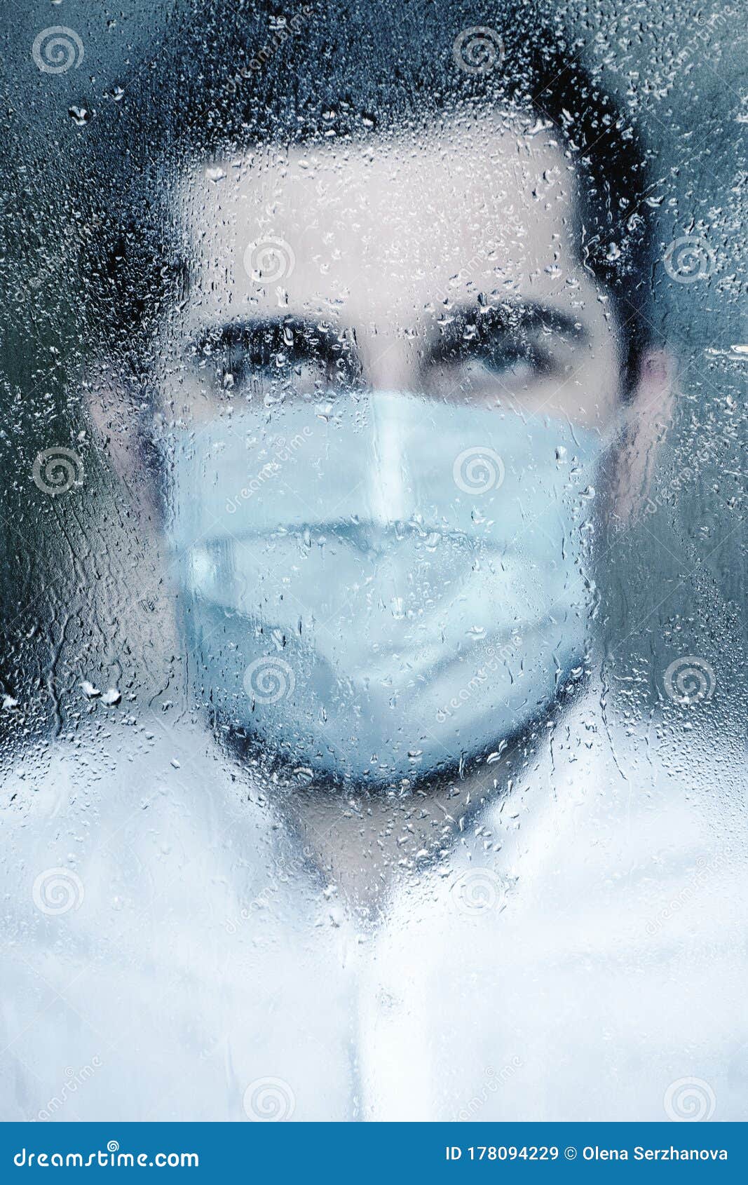Blurred Image of Young Man in Protective Mask Standing Behind the