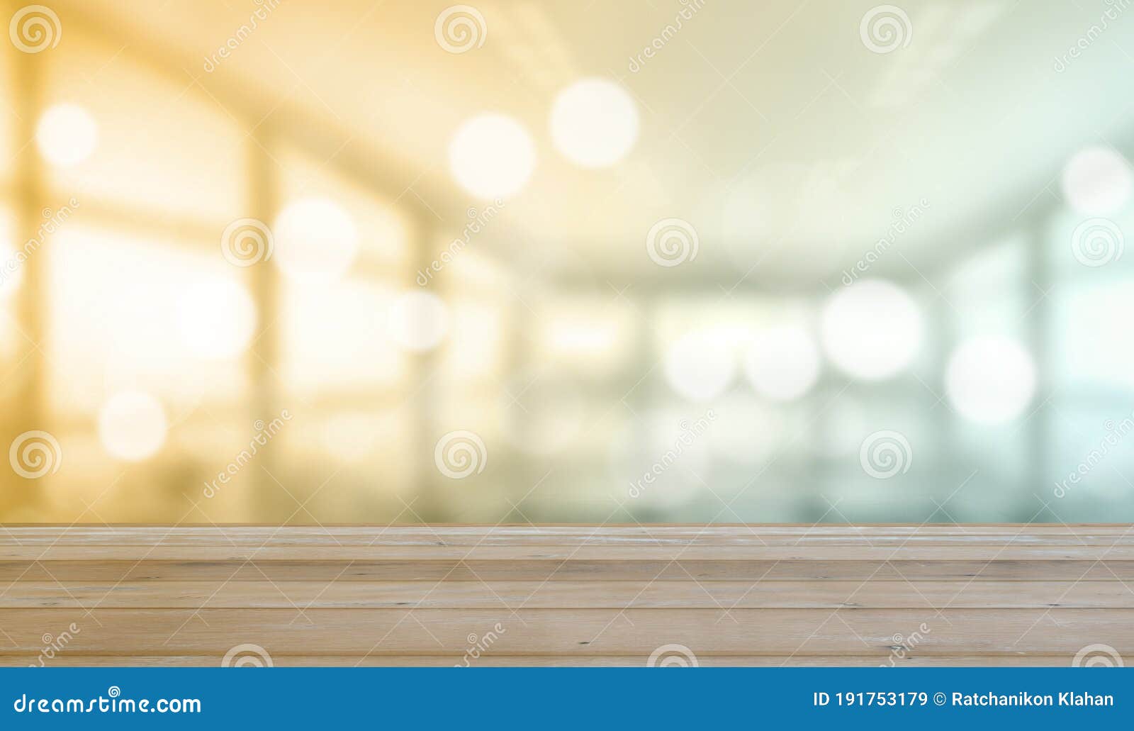 wooden table with blurred of interior office room with city building background
