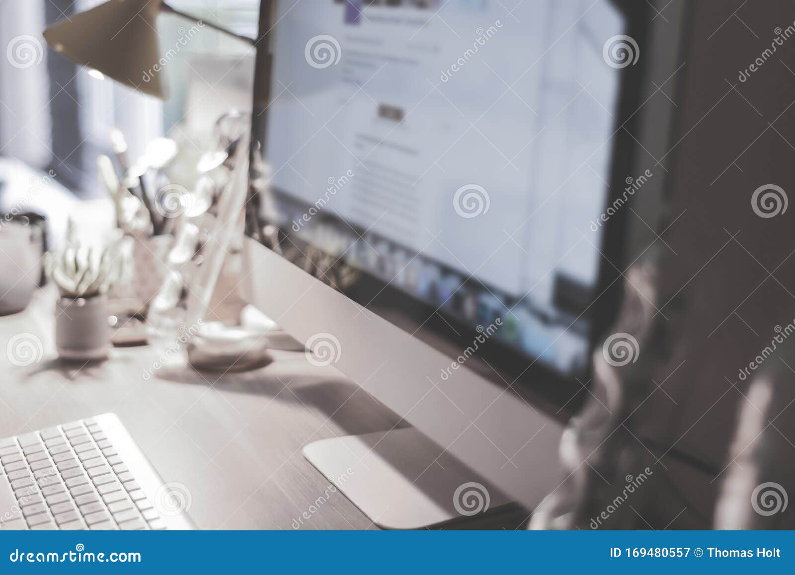 Blurred Large Computer Screen On A Home Office Desk Interior Eith