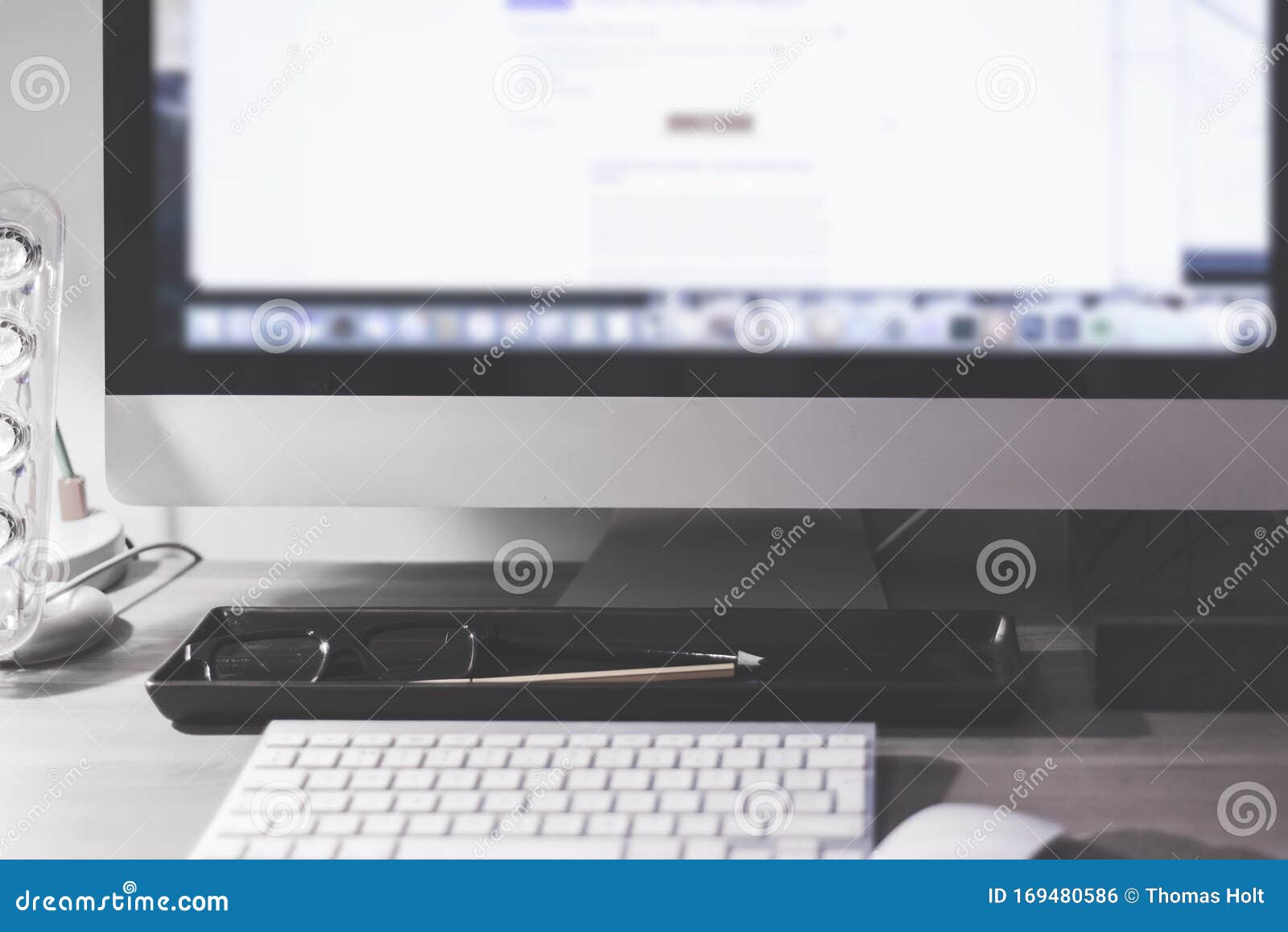 Blurred Large Computer Screen On A Home Office Desk Interior With