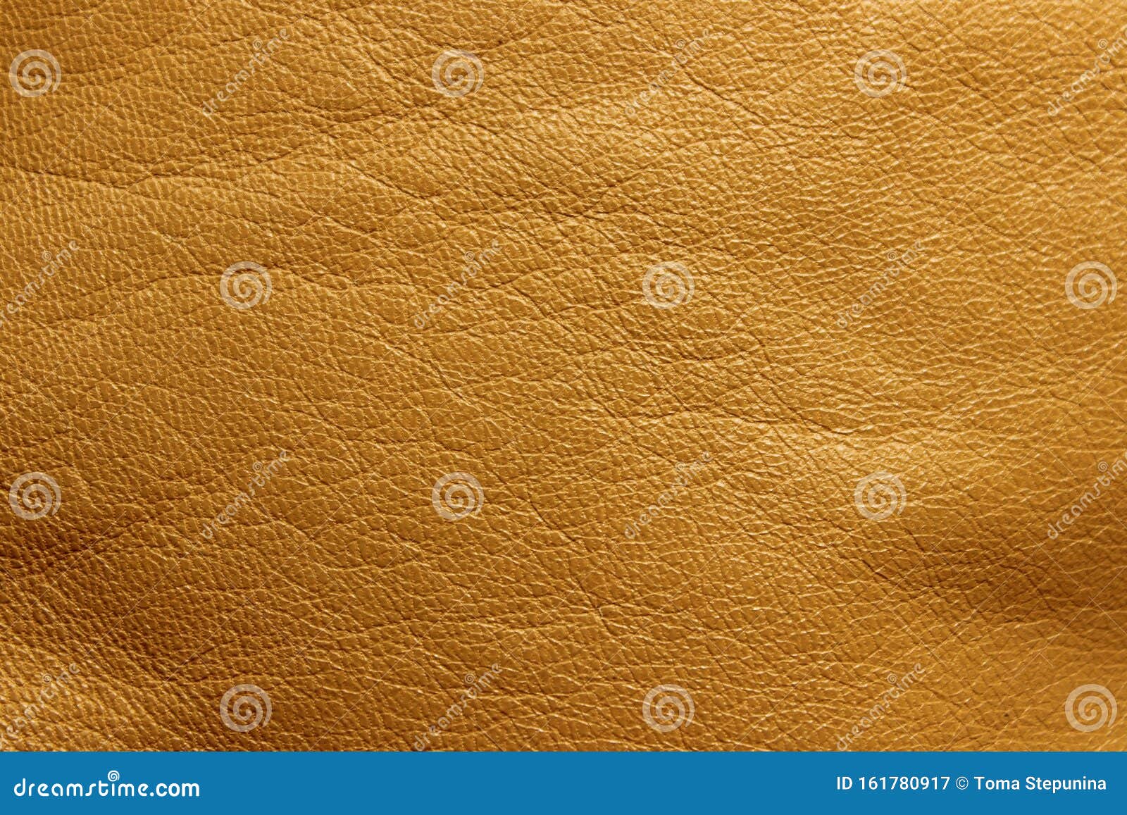 blurred leather background, ocher color. abstract texture background out of focus.