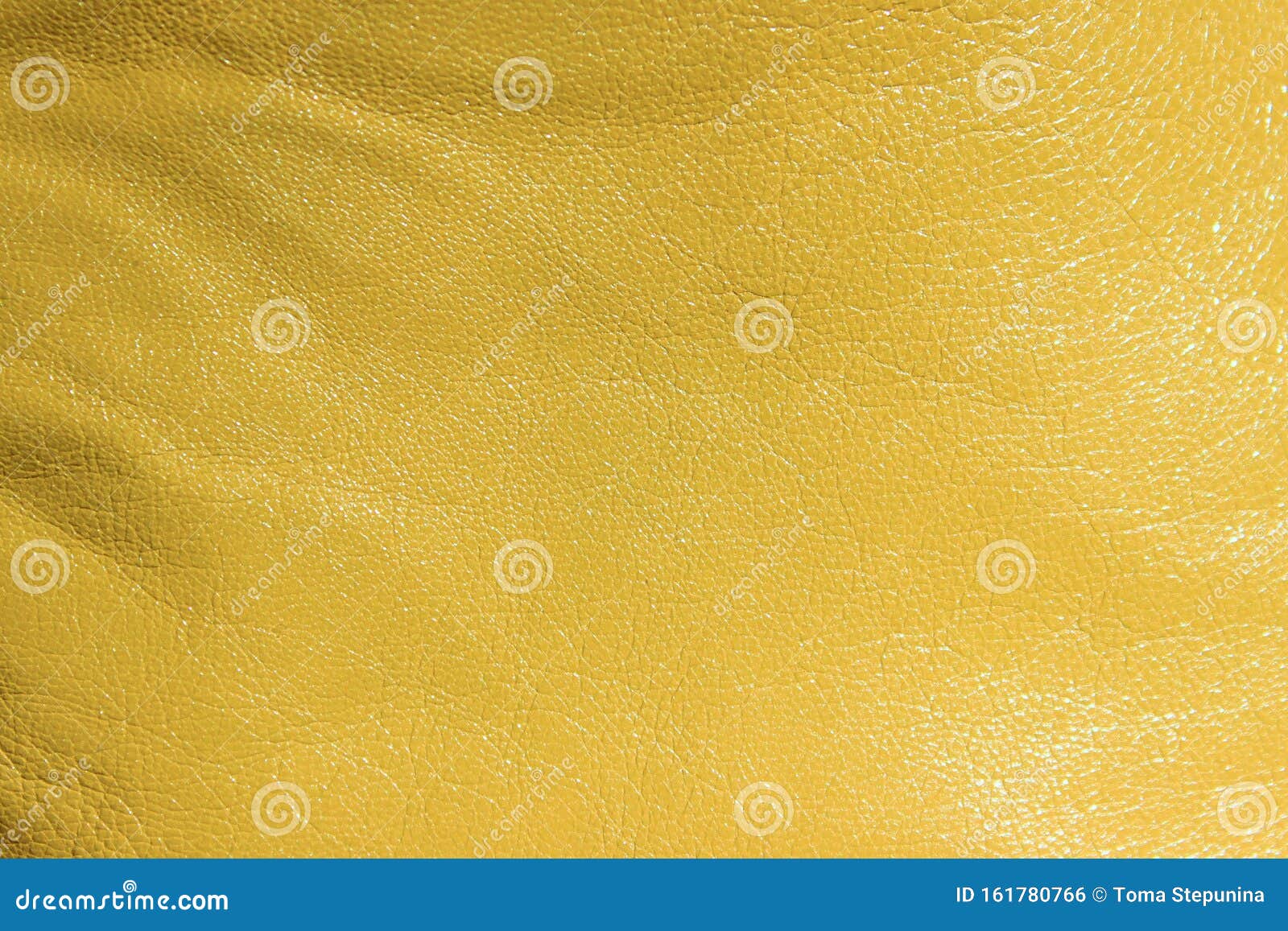 blurred leather background, ocher color. abstract texture background out of focus.