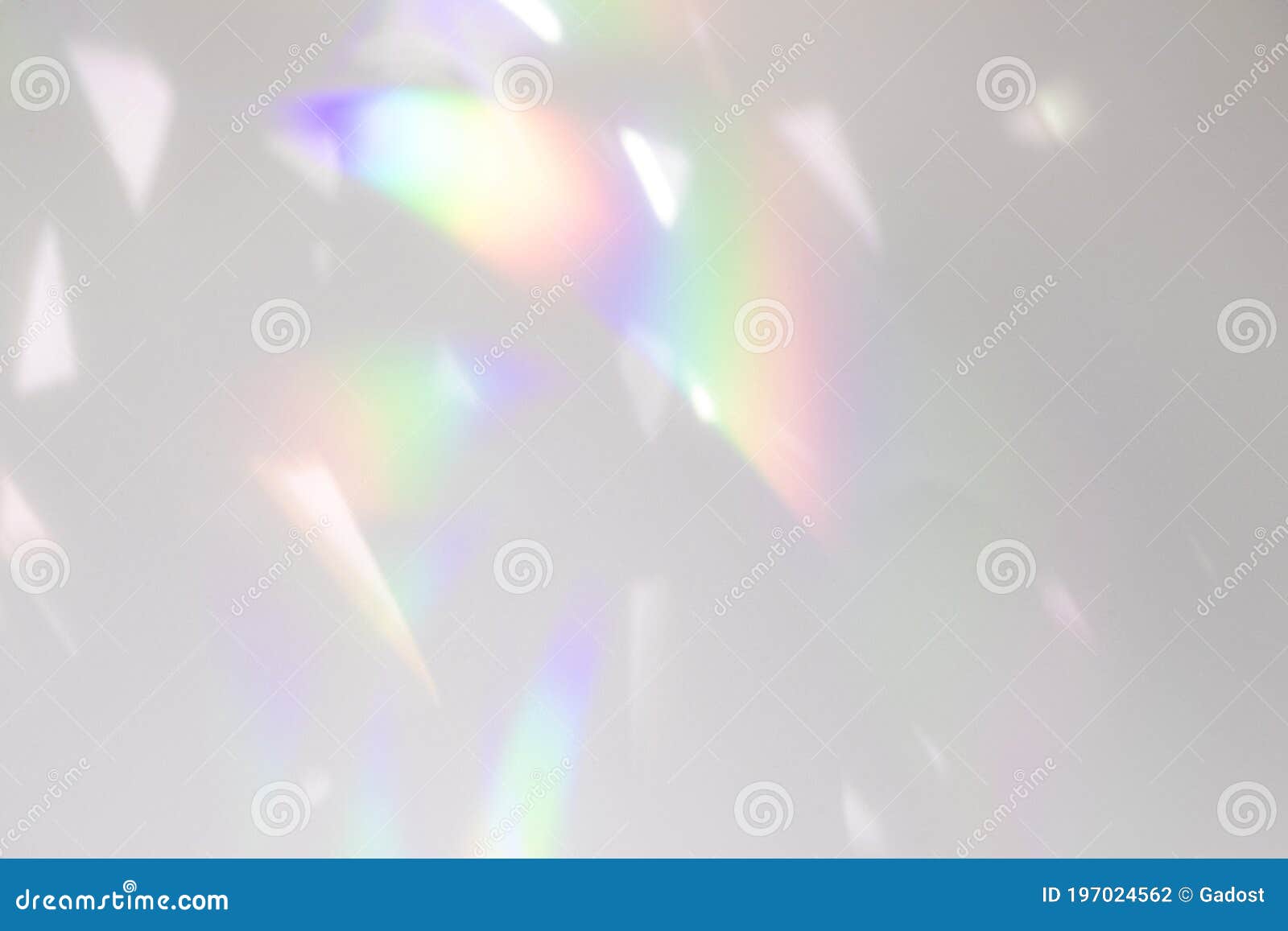 blurred rainbow light refraction texture on white wall