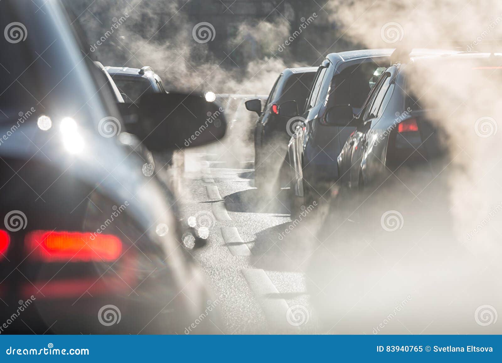 Blurred Silhouettes of Cars Surrounded by Steam from the Exhaust Stock ...