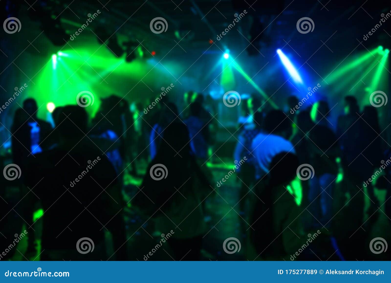 Blurred Silhouettes of a Group of People Dancing in a Nightclub on the ...