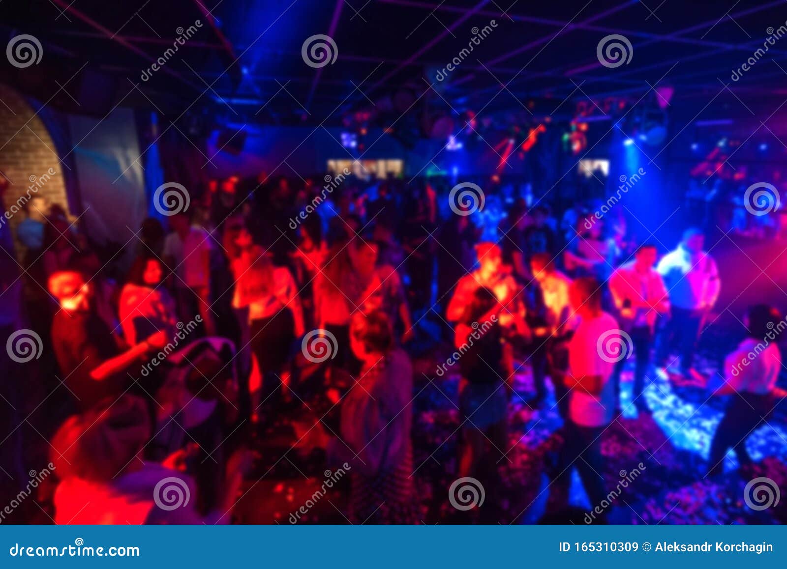 Blurred Silhouettes of a Group of People Dancing in a Nightclub on the ...