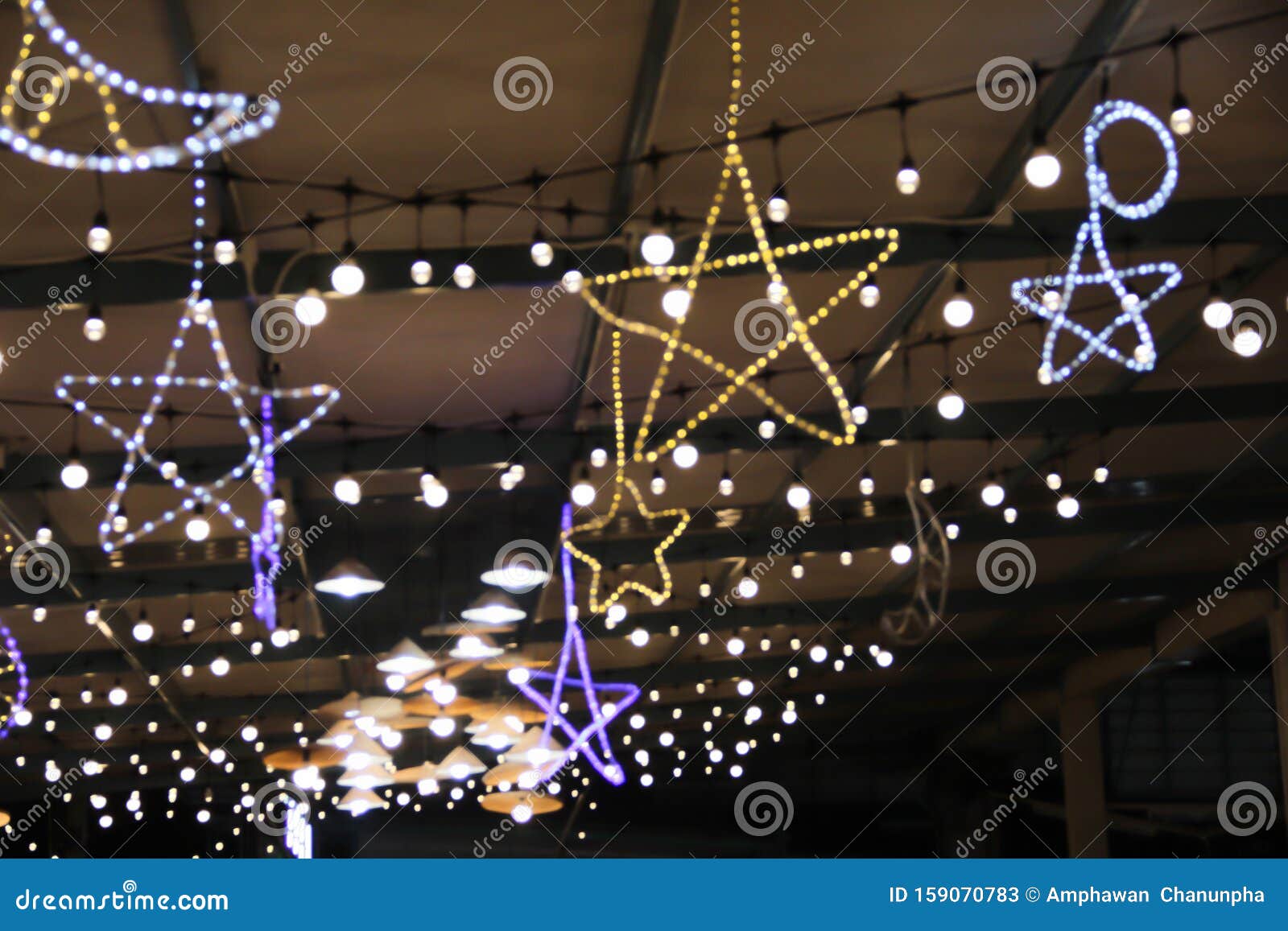 Blurred Star Shaped Patterns Night Light Bulb Hanging On The