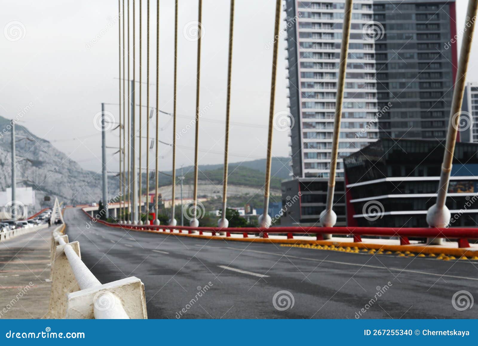 blurred view of modern bridge near city